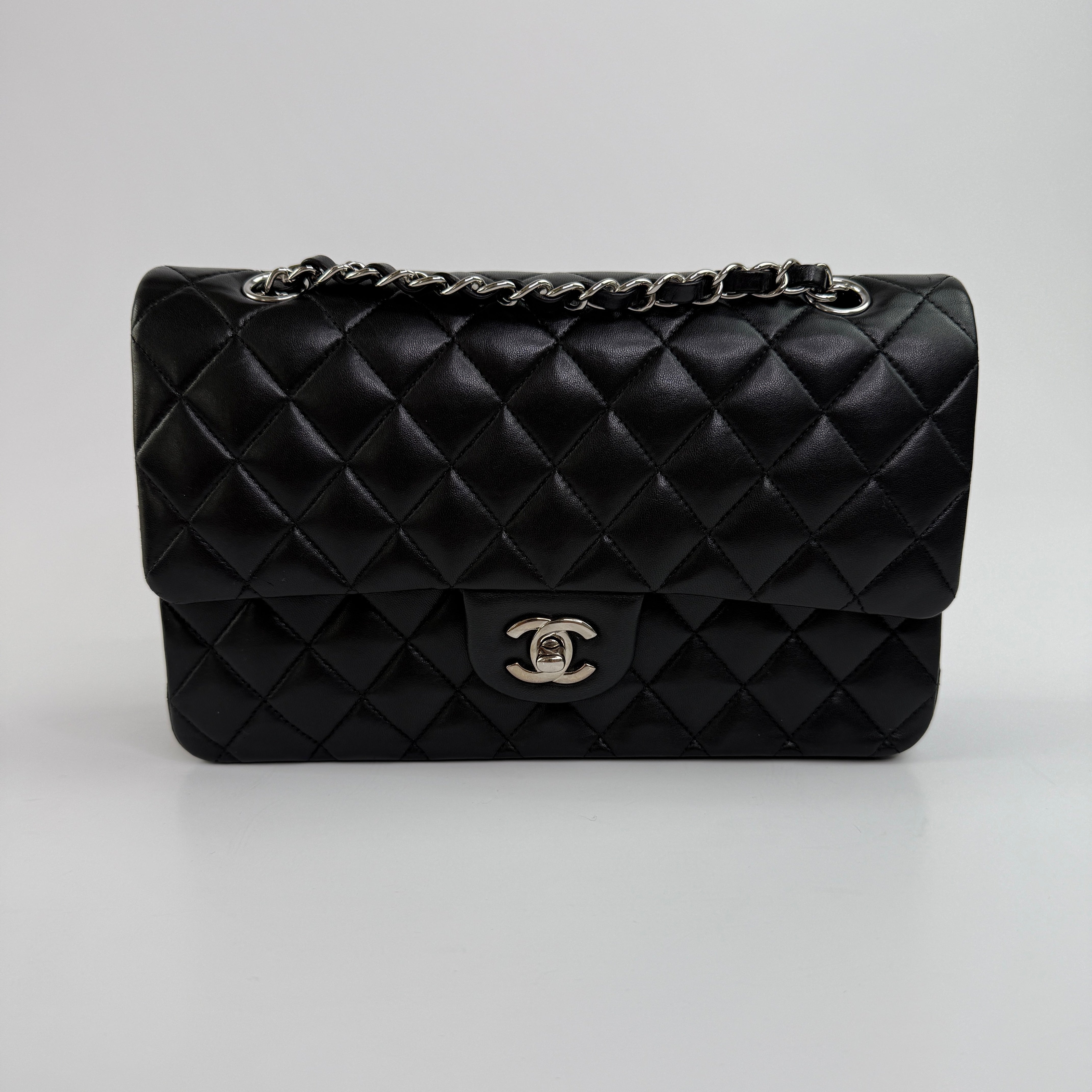 Chanel Medium Classic Double Flap Black Lambskin Leather With Silver Hardware
Pre Loved & Authentic 