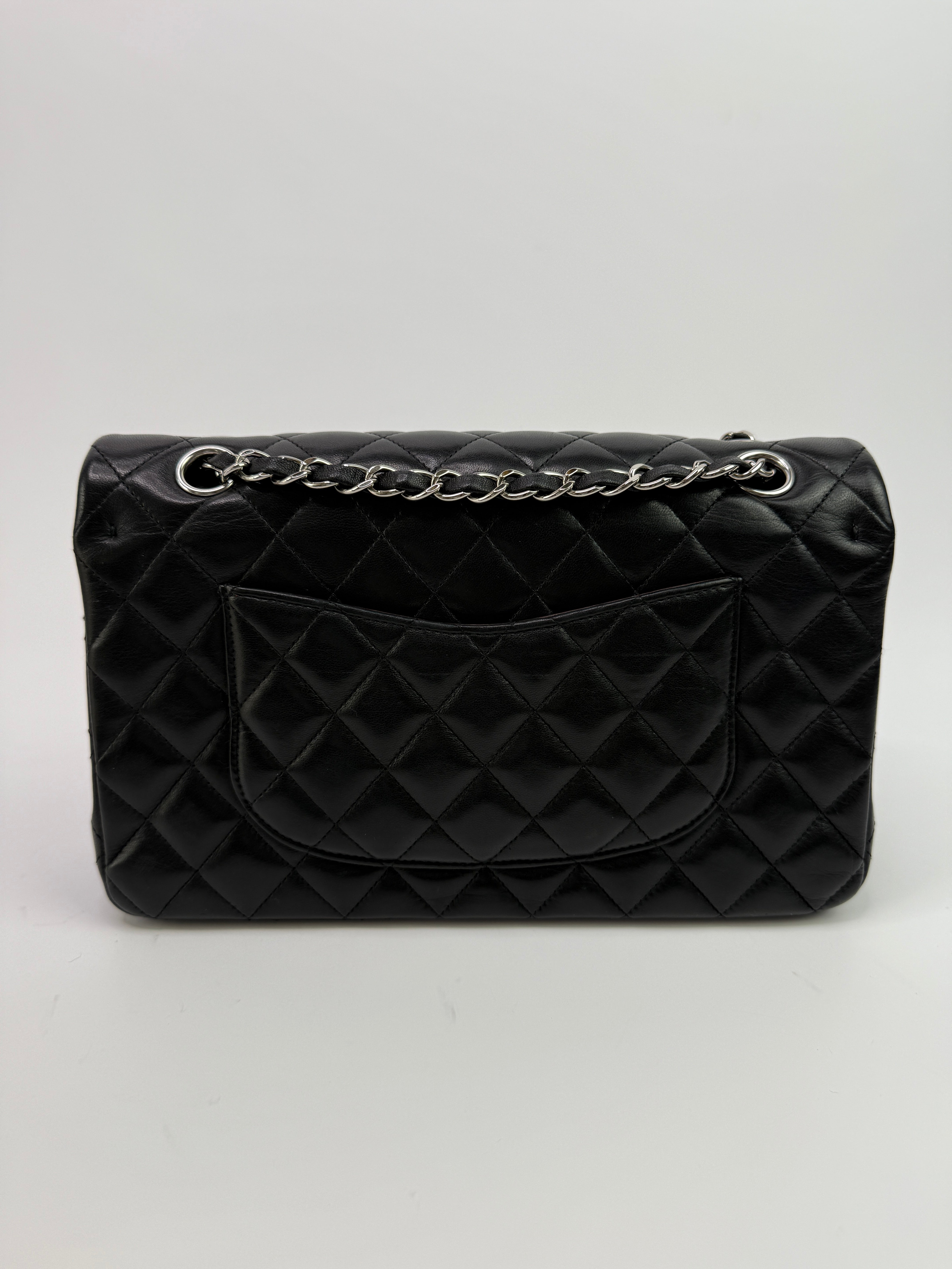 Authentic and preloved Chanel Medium Classic Double Flap Black Lambskin With Silver hardware Excellent condition. 100% Authenticity guarantee 
