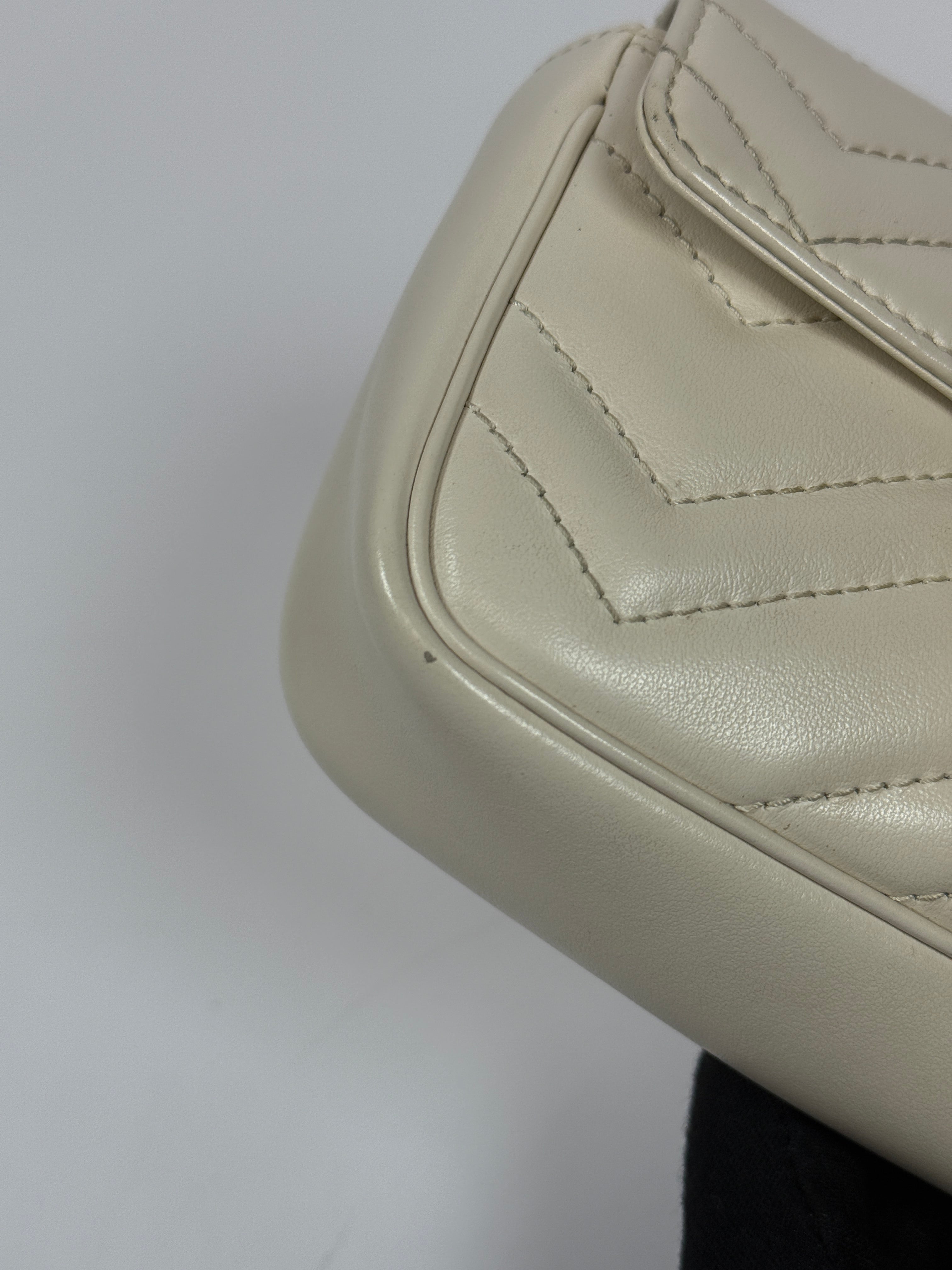 Gucci Marmont White  Matelassé Super Mini Bag With Gold Hardware In Excellent pre loved condition. Authentic and preloved