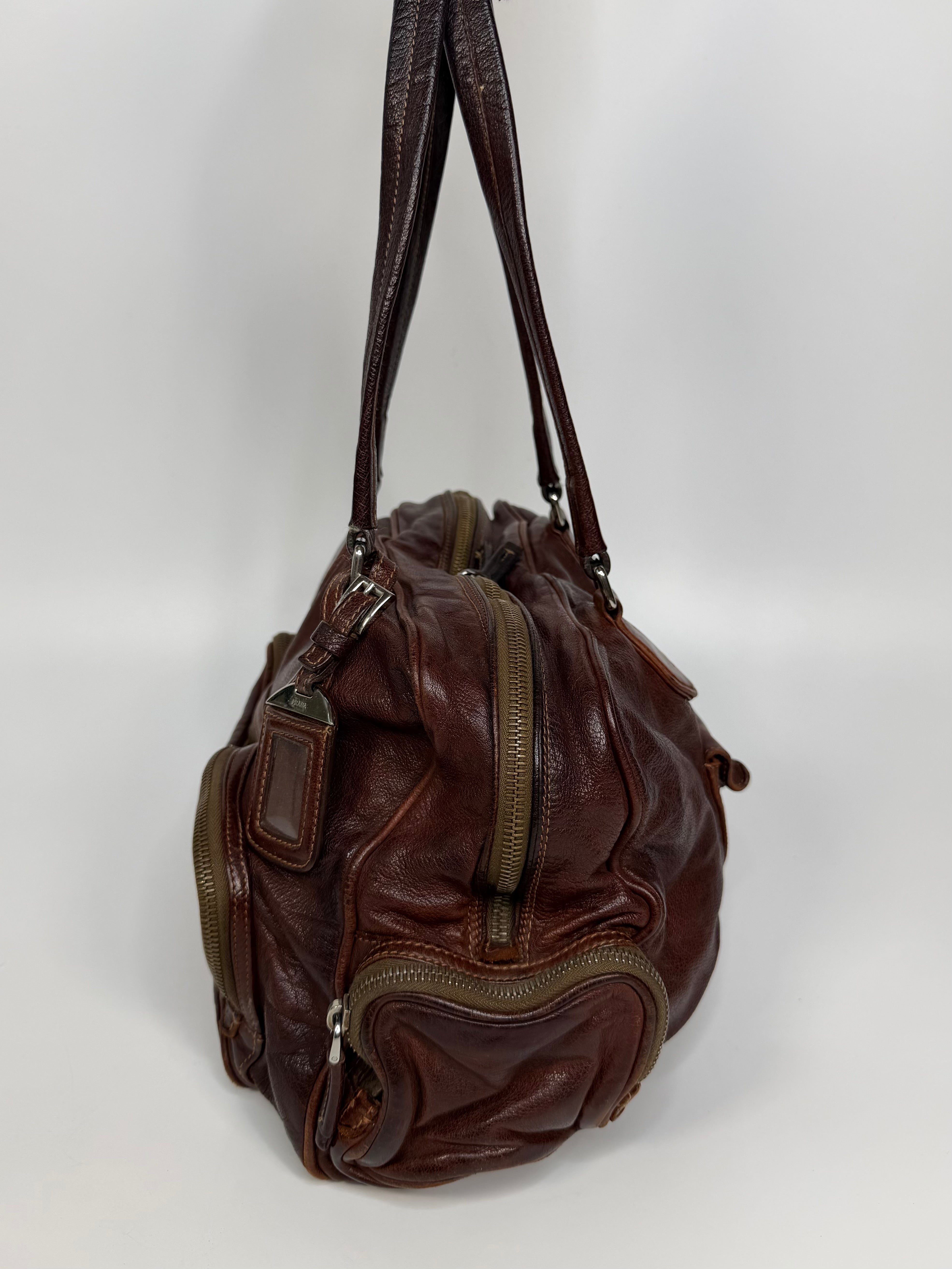 Prada Washed Bauletto Shoulder Bag In Brown Leather With Gold Hardware. Authentic and preloved in very good condition