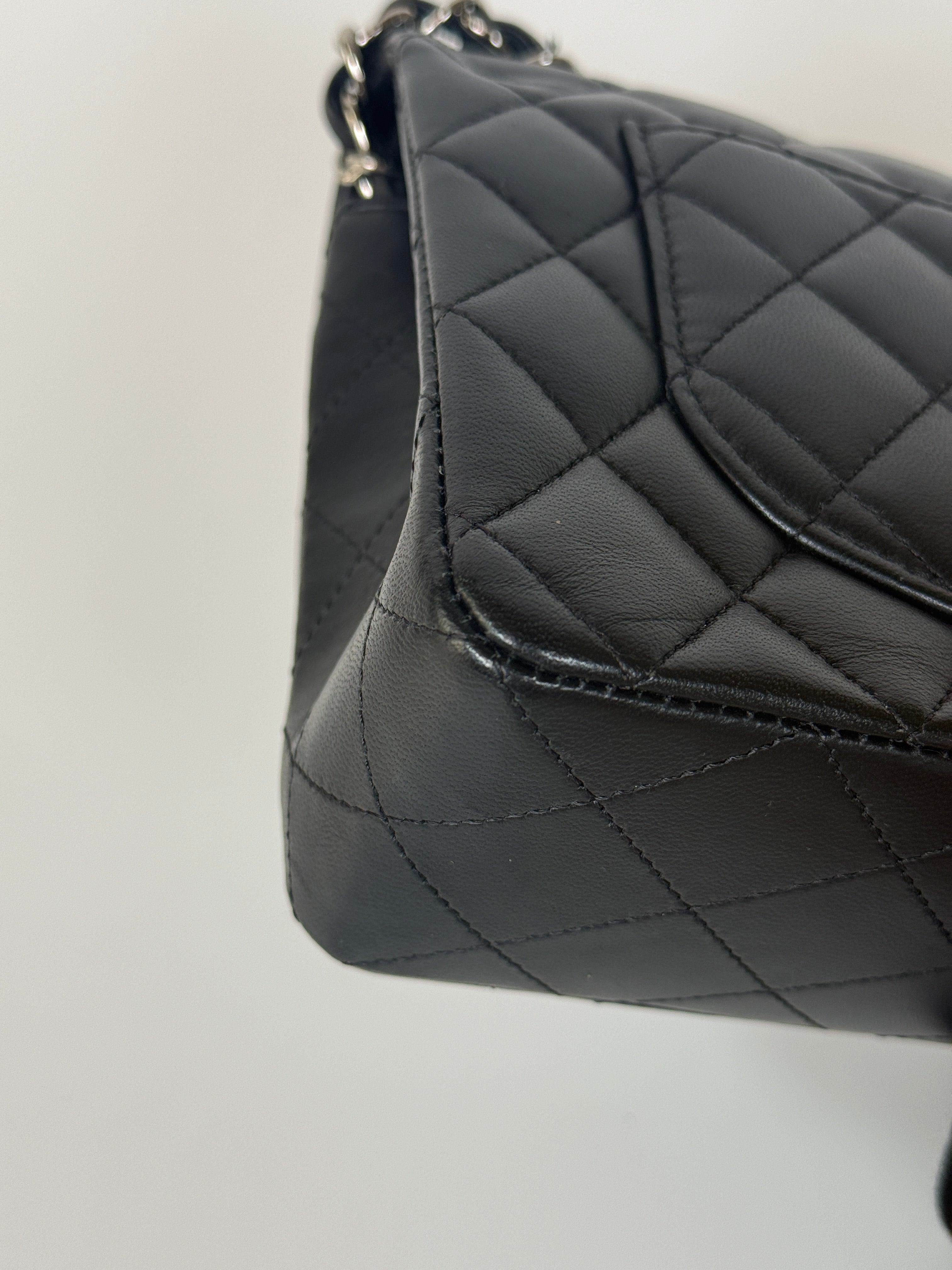 Authentic and preloved Chanel Small Classic Double Flap In Black Lambskin Leather With Silver hardware 100% Authenticity guarantee