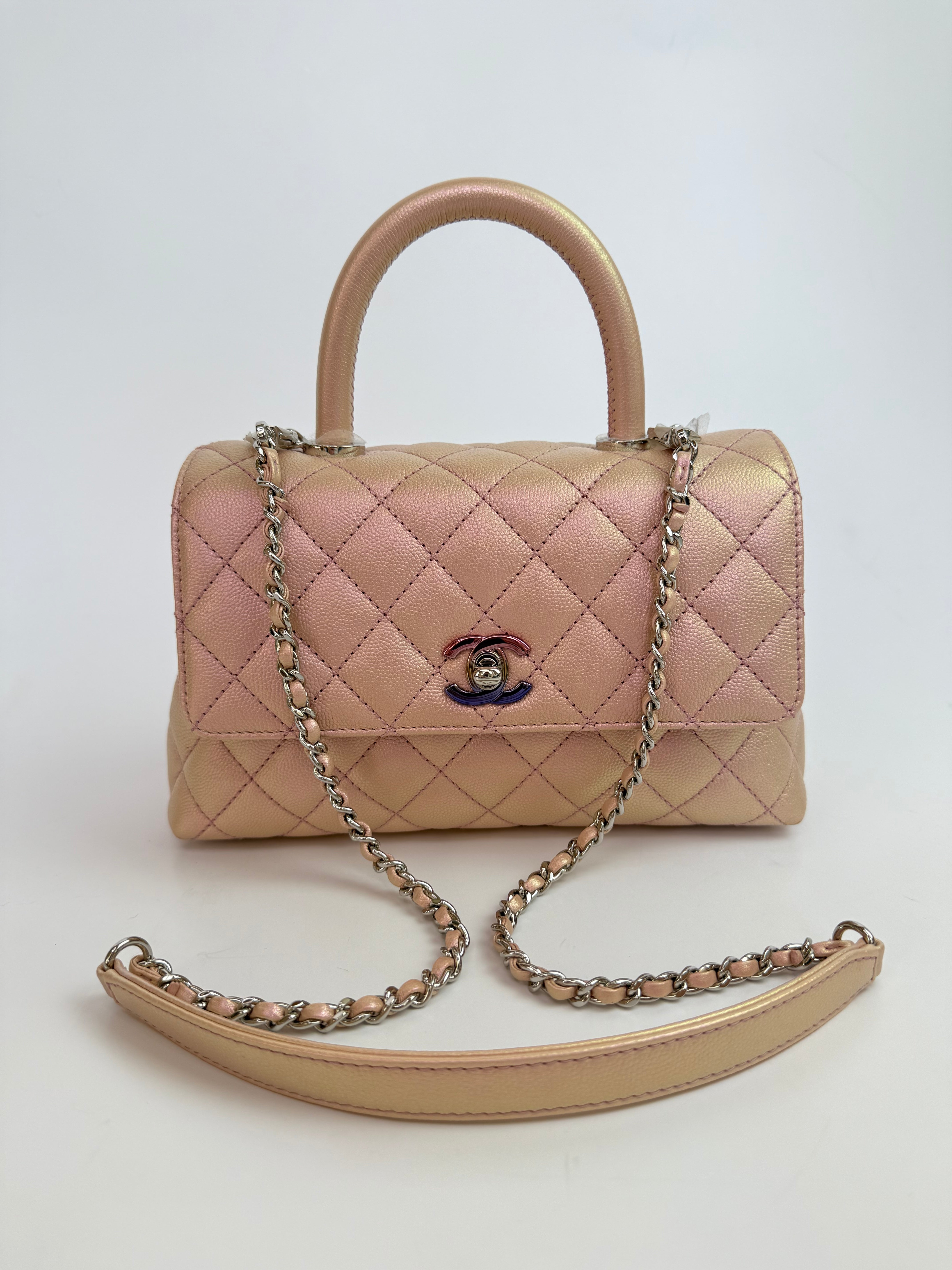 Authentic pre-loved Chanel Small Coco In Iridescent Pink Caviar With Rainbow Hardware. 