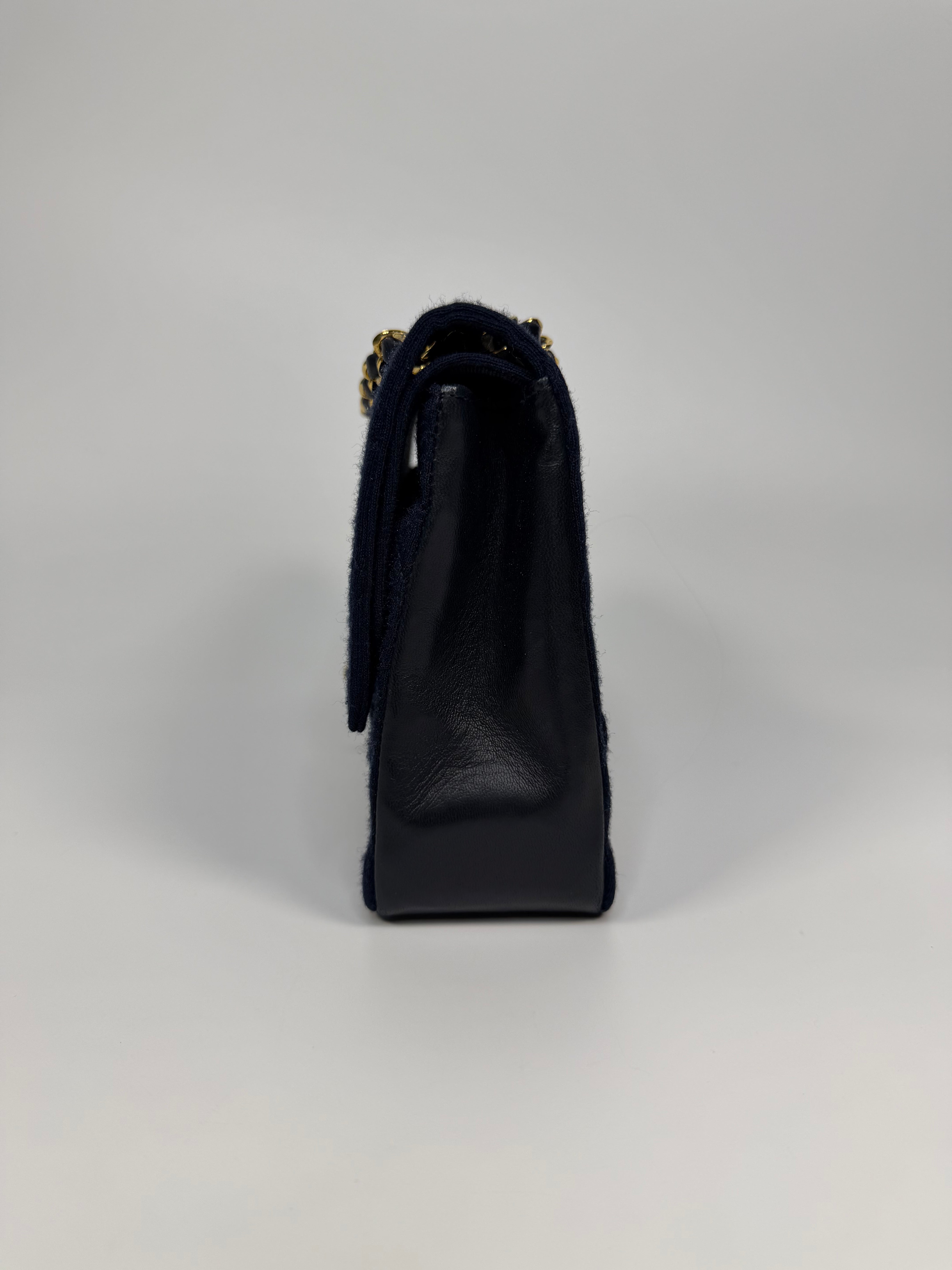 Chanel Vintage Medium Double Flap Navy Cotton With 24Kt Gold Hardware. Authentic and preloved in excellent condition.