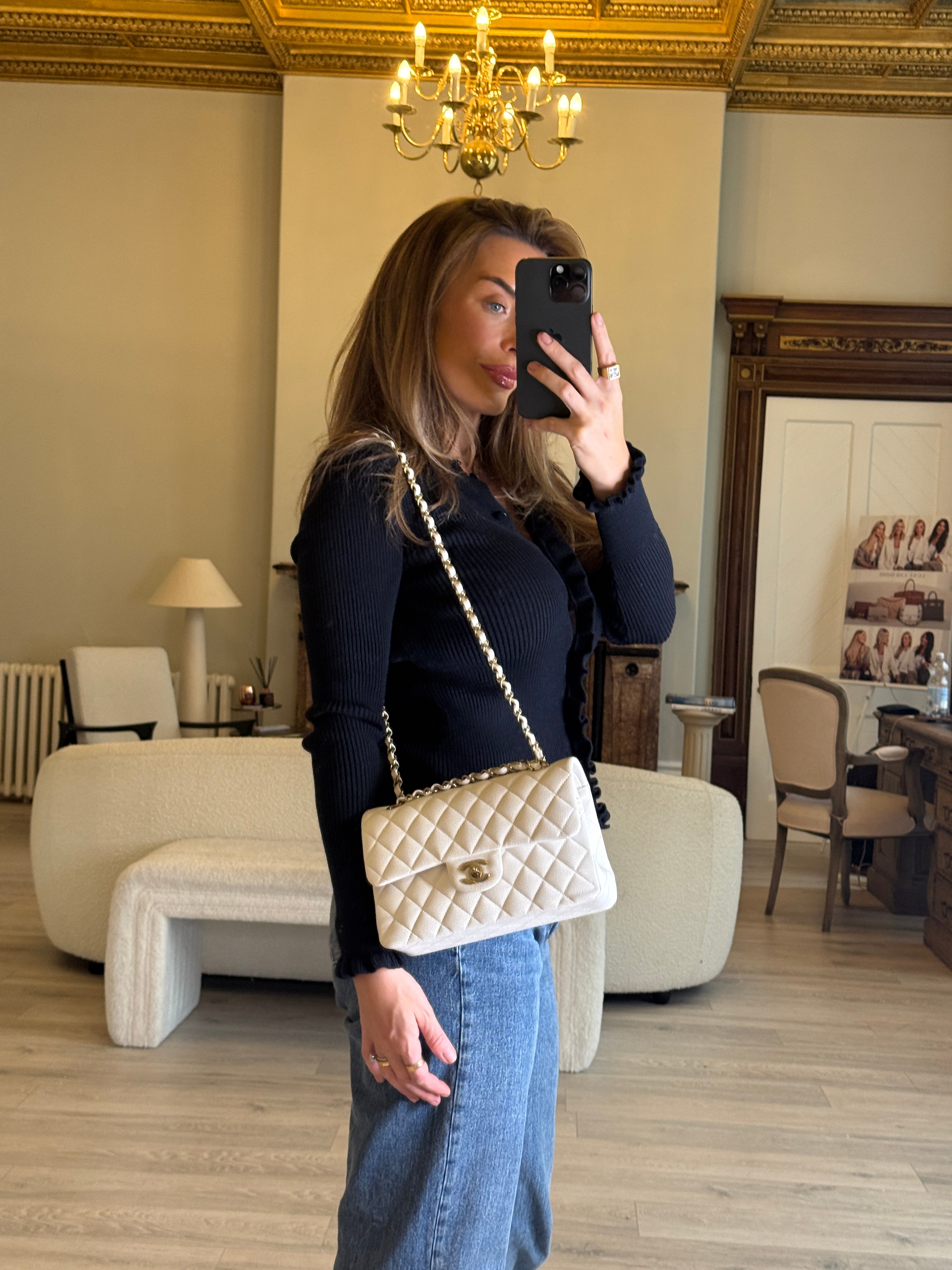 Authentic and preloved Chanel Small Classic Double Flap In White Caviar Leather With pale gold hardware. Very Good Condition. 100% Authenticity guarantee 