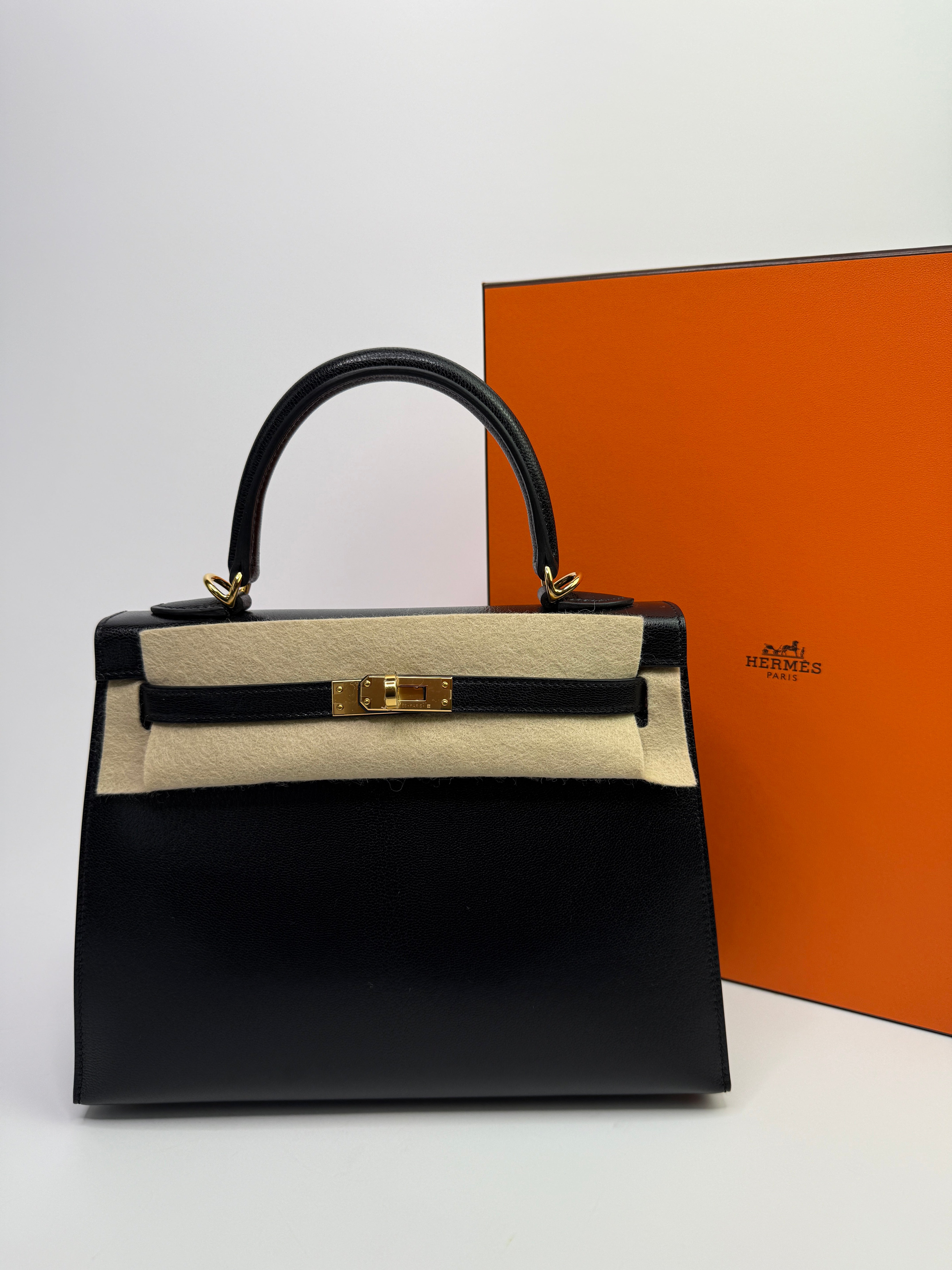 Authentic Pre Loved Hermès Kelly 25 Sellier In Black Chevre Chamilka Leather with Yellow Gold Hardware New & Unused Condition