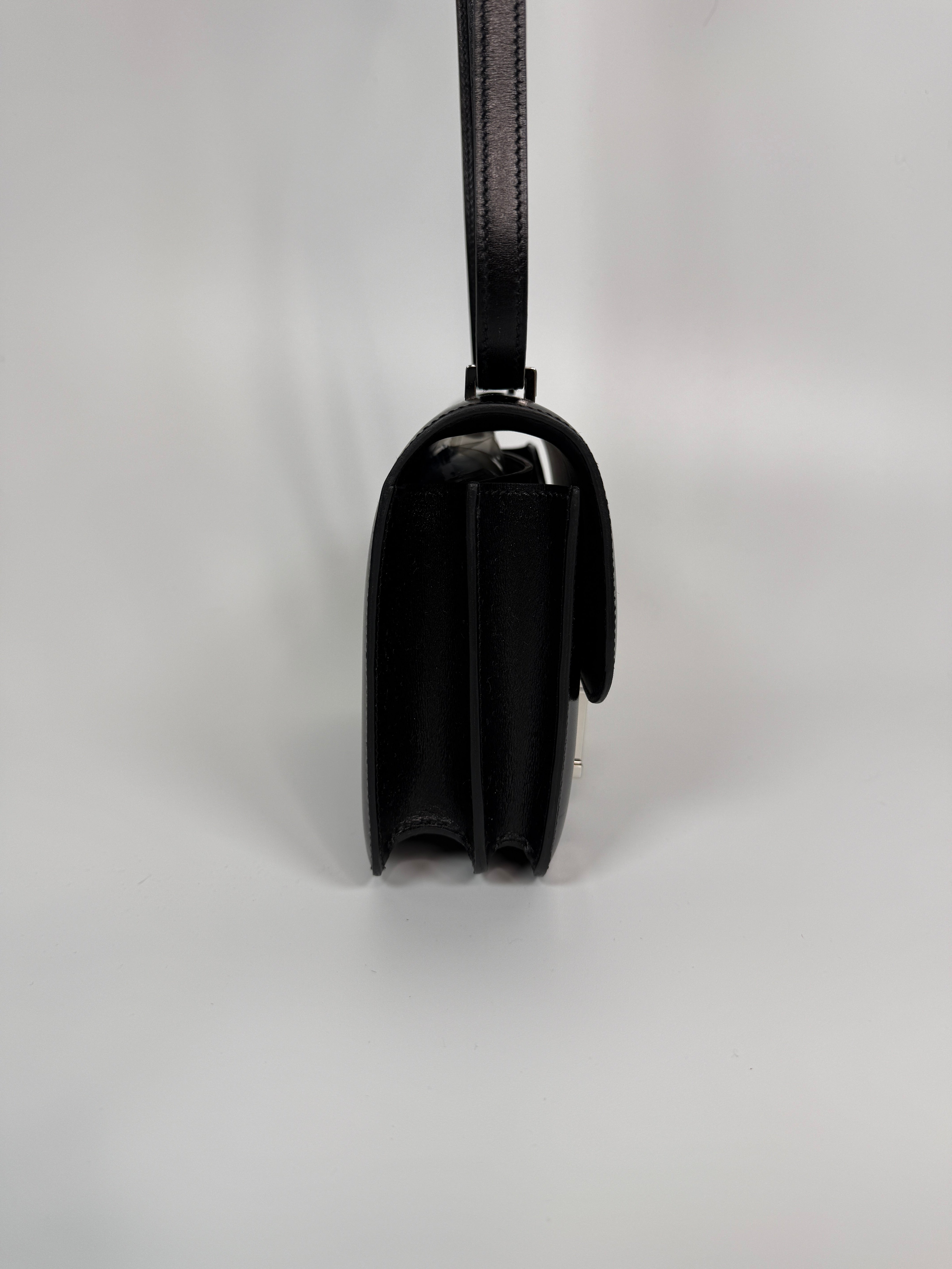 Authentic and preloved Hermès Constance 18 In Black Box Leather With Palladium Hardware. 100% Authenticity guarantee. 