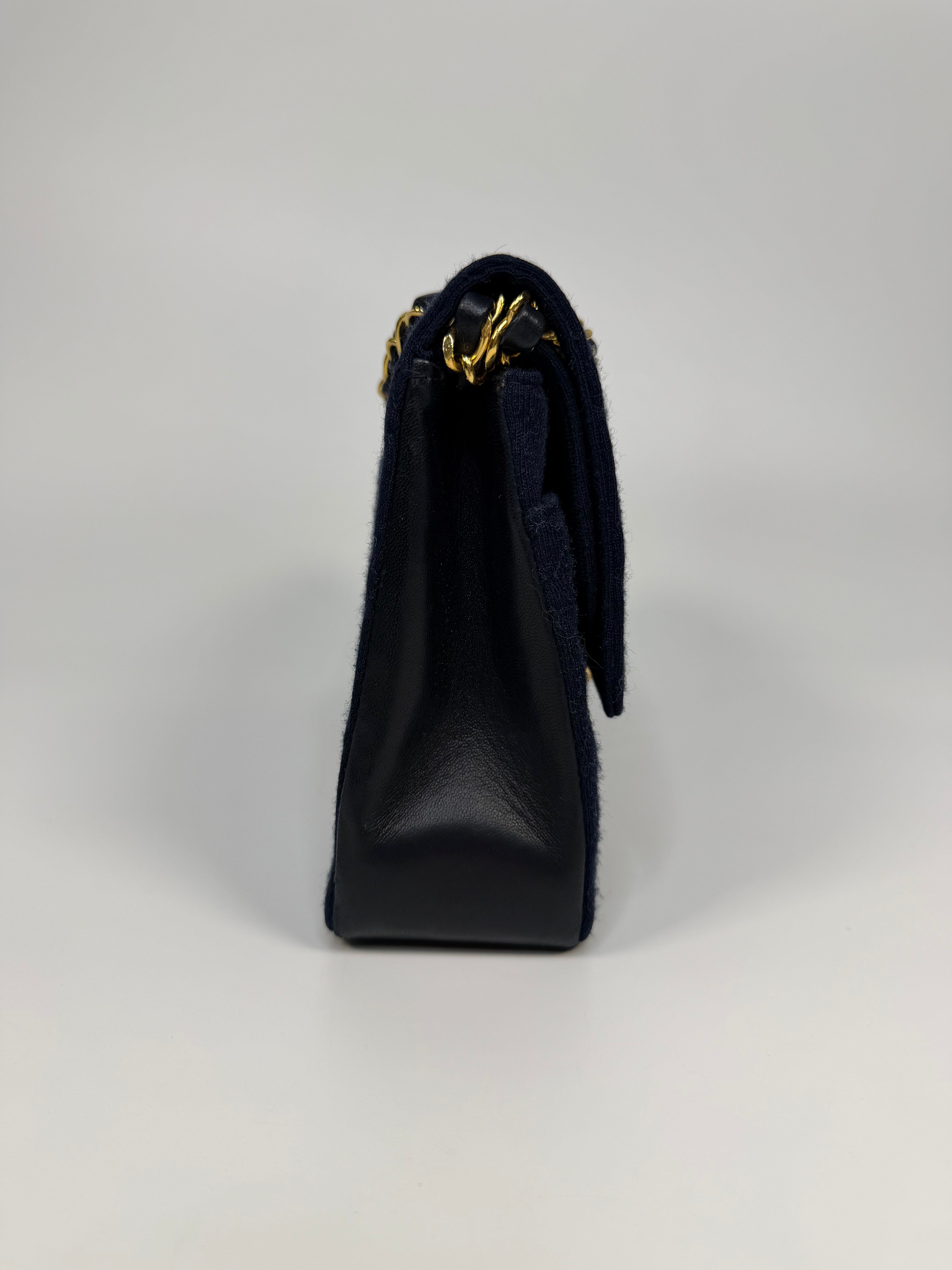 Chanel Vintage Medium Double Flap Navy Cotton With 24Kt Gold Hardware. Authentic and preloved in excellent condition.