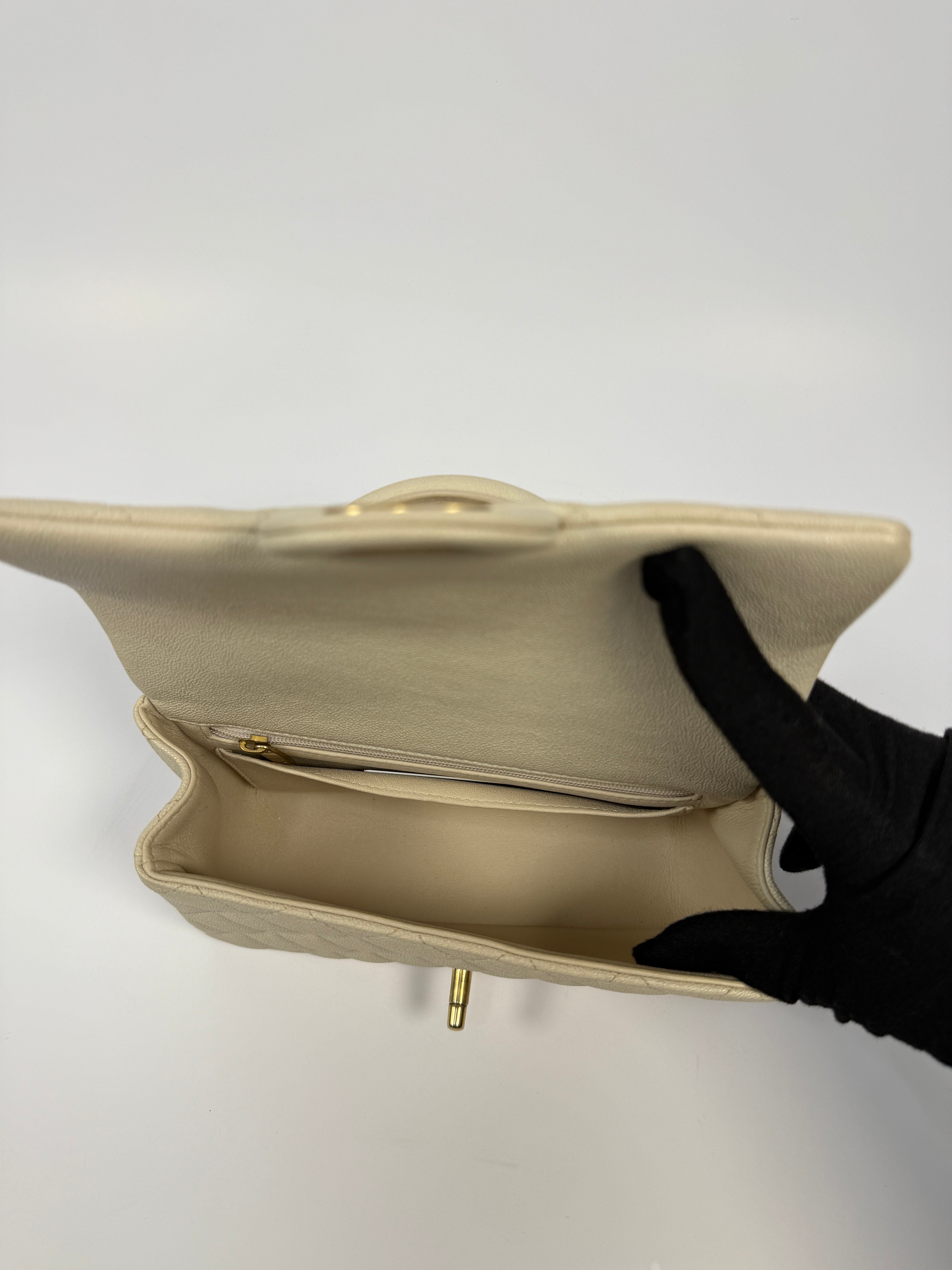 Chanel Mini Rectangle Top Handle In Ecru Caviar With Gold hardware, authentic and preloved in excellent condition