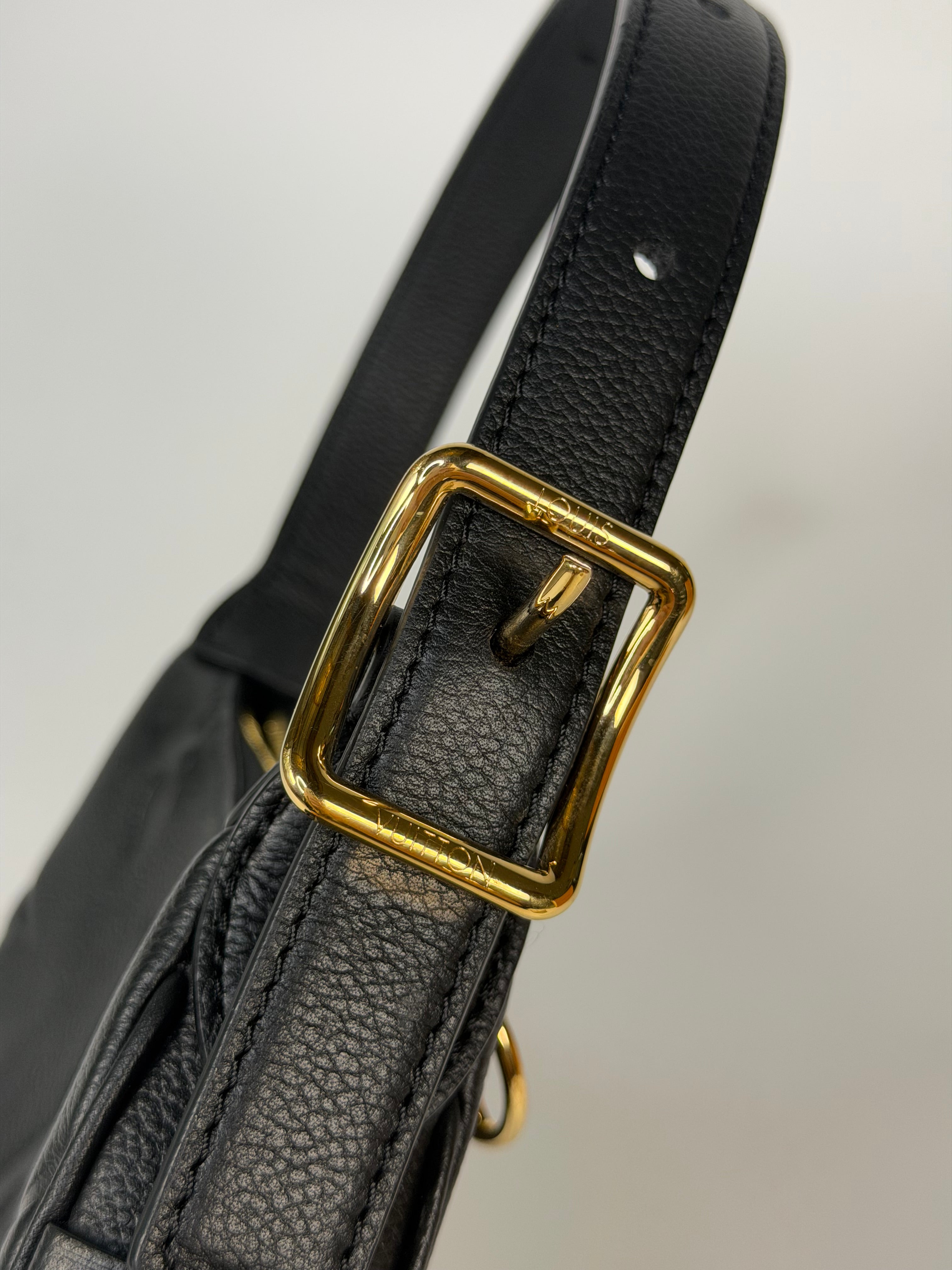 Louis Vuitton Mini Moon Bag In Black Leather With Gold Hardware in excellent condition 100% authentic and preloved