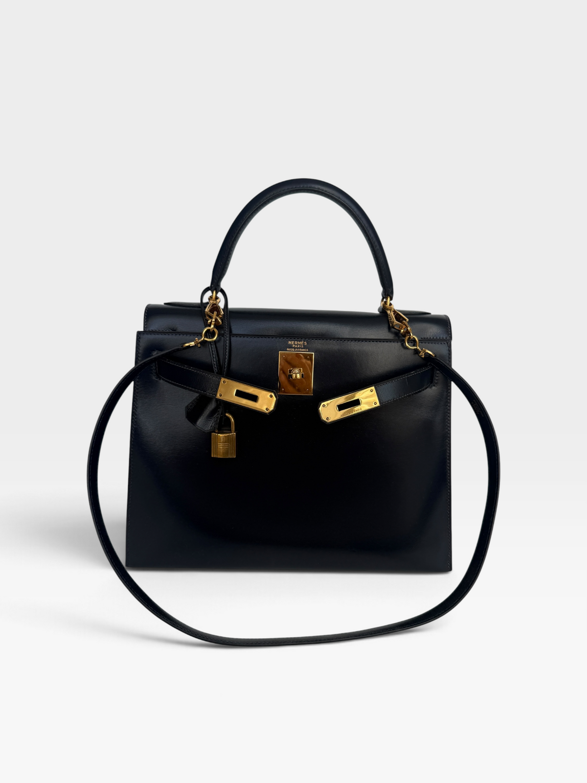 Hermès Vintage Kelly 28 In Navy Sellier Box Leather With Gold Hardware. 100% authentic and preloved in excellent condition.