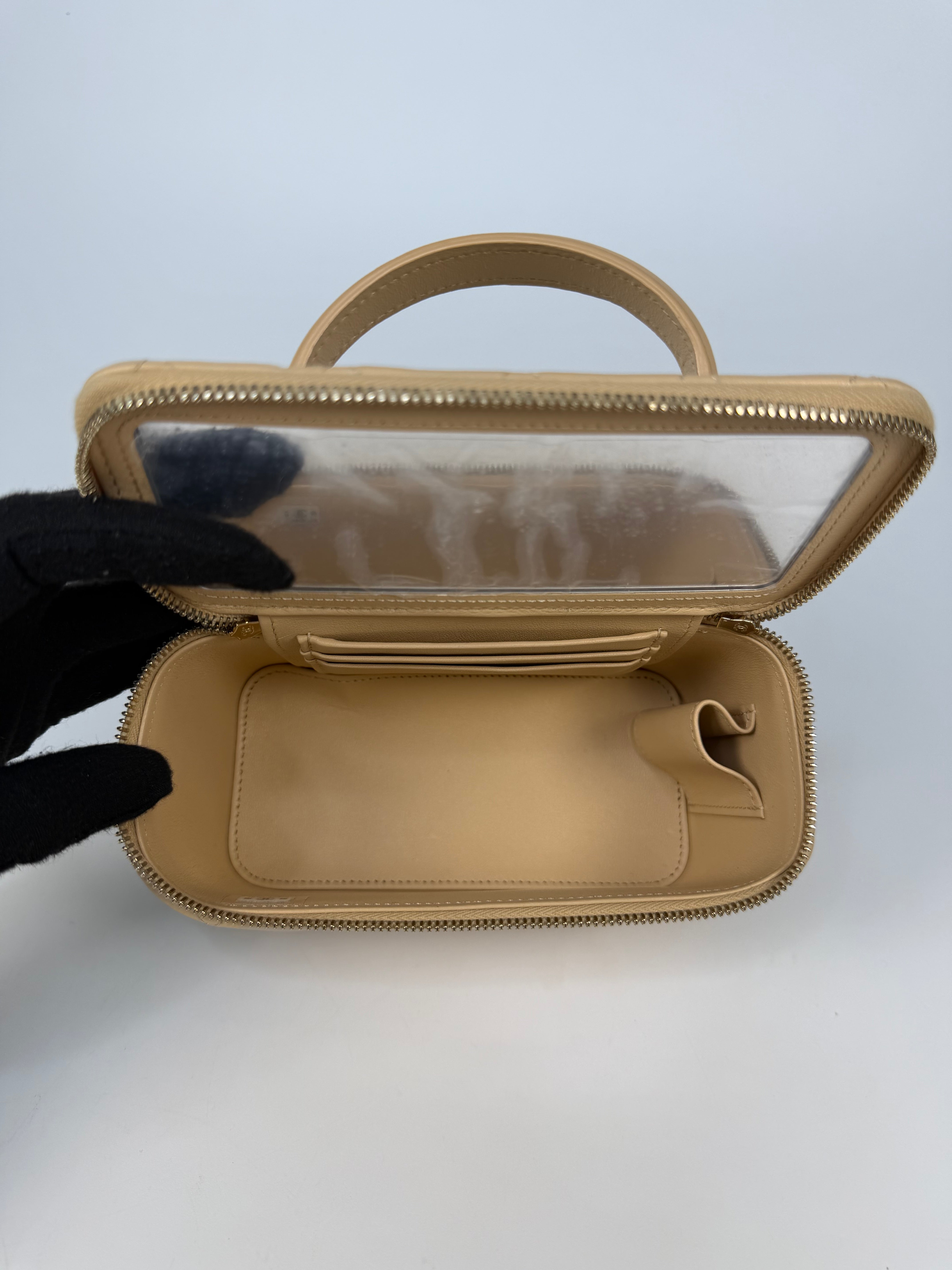 Chanel Mini Vanity Top Handle In Light Beige Lambskin Leather With Gold Hardware. Authentic and preloved in excellent condition. Insured next day delivery. Verified by Luxe Cheshire