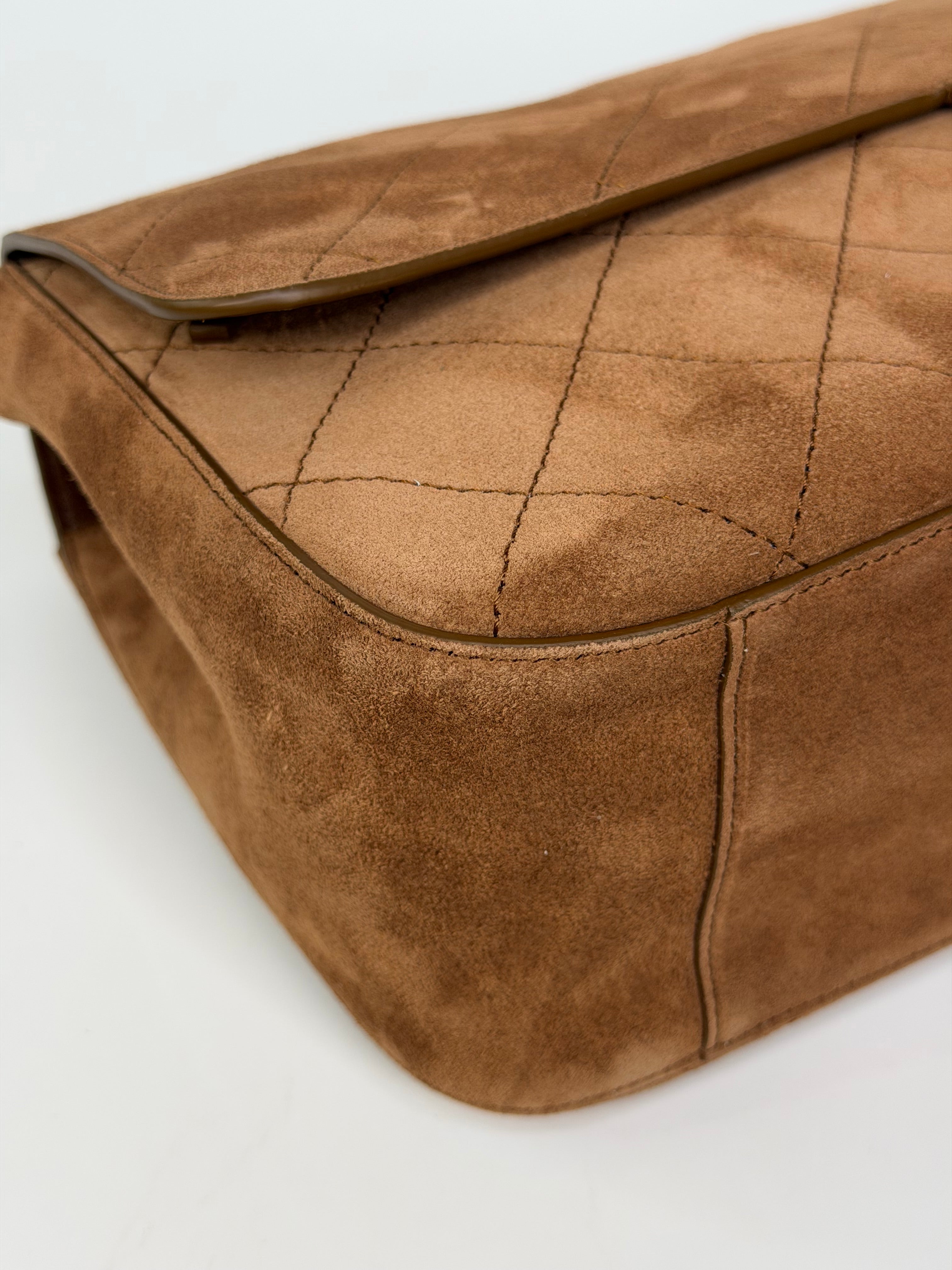 Chanel Maxi Flap In Tan Suede With Gold Hardware. Authentic and preloved in new and unused condition.