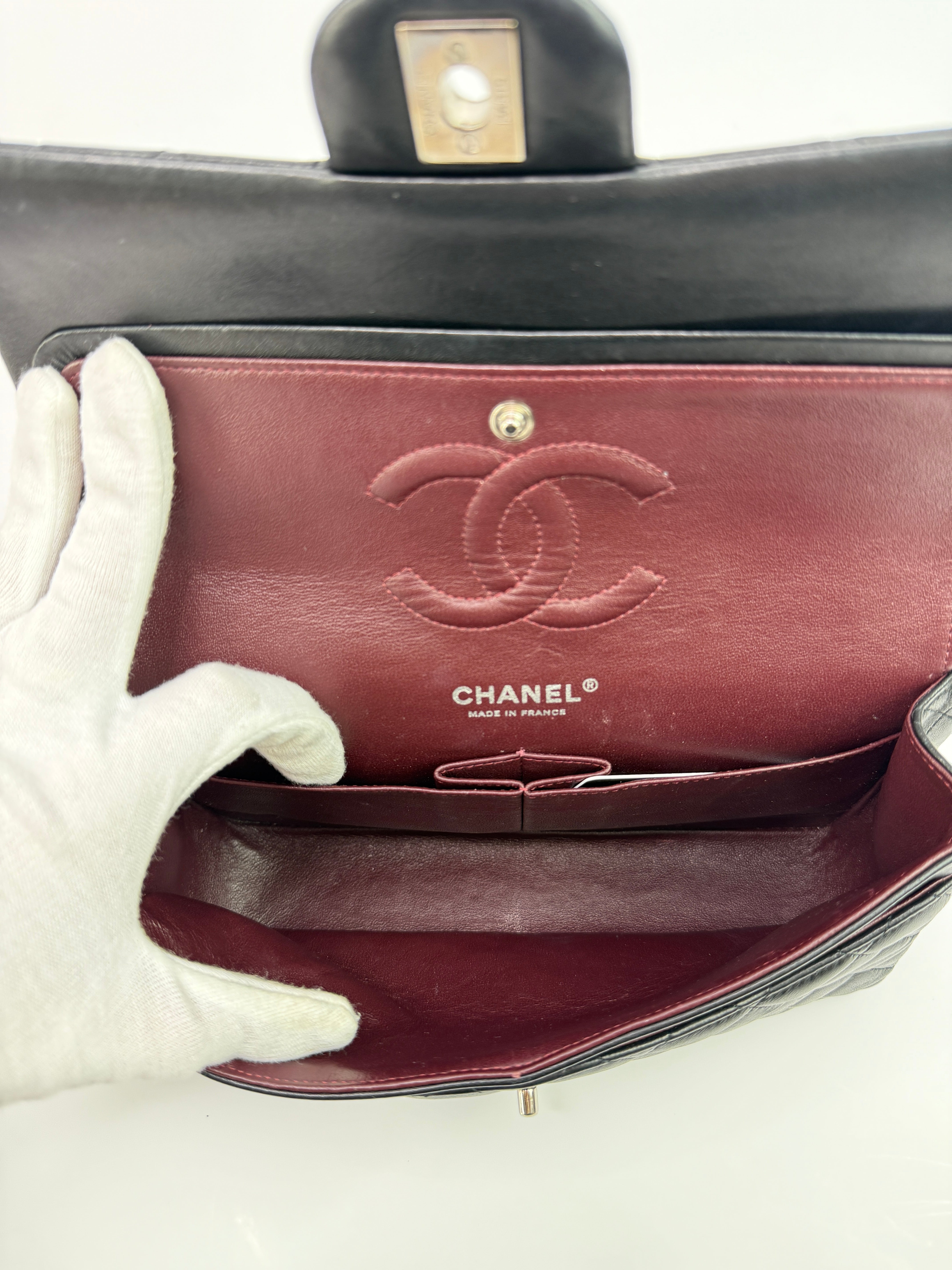 Authentic and preloved Chanel Medium Classic Double Flap Black Lambskin With Silver hardware Excellent condition. 100% Authenticity guarantee 
