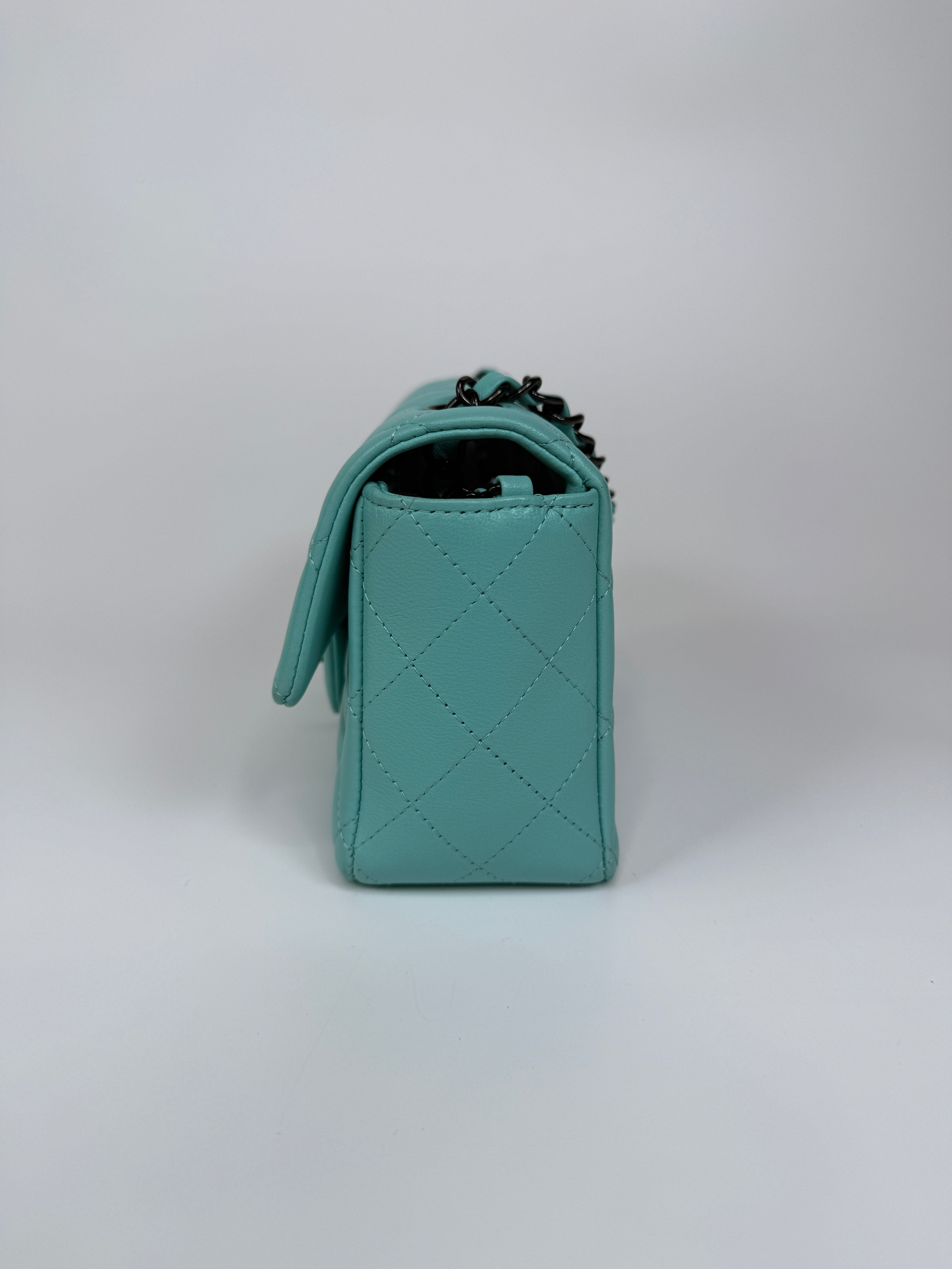 Authentic and preloved Chanel Mini Rectangle Flap Bag In Turquoise Lambskin Leather With Gunmetal Hardware In Excellent condition. Verified by Luxe Cheshire. 100% Authenticity Guarantee. 