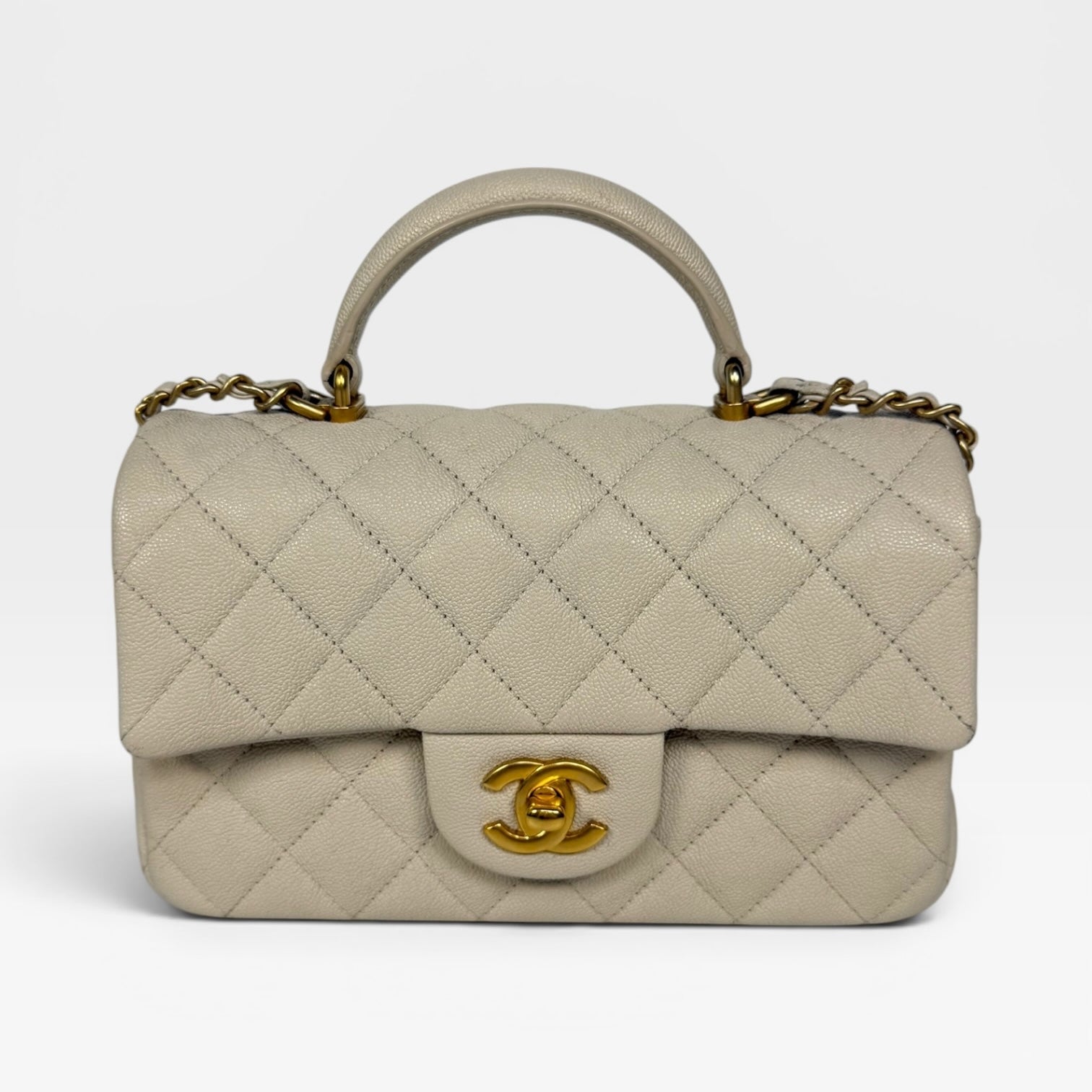 Chanel Mini Rectangle Top Handle In Cream Caviar Leather With Aged Gold Hardware. 100% authentic and preloved in excellent condition.