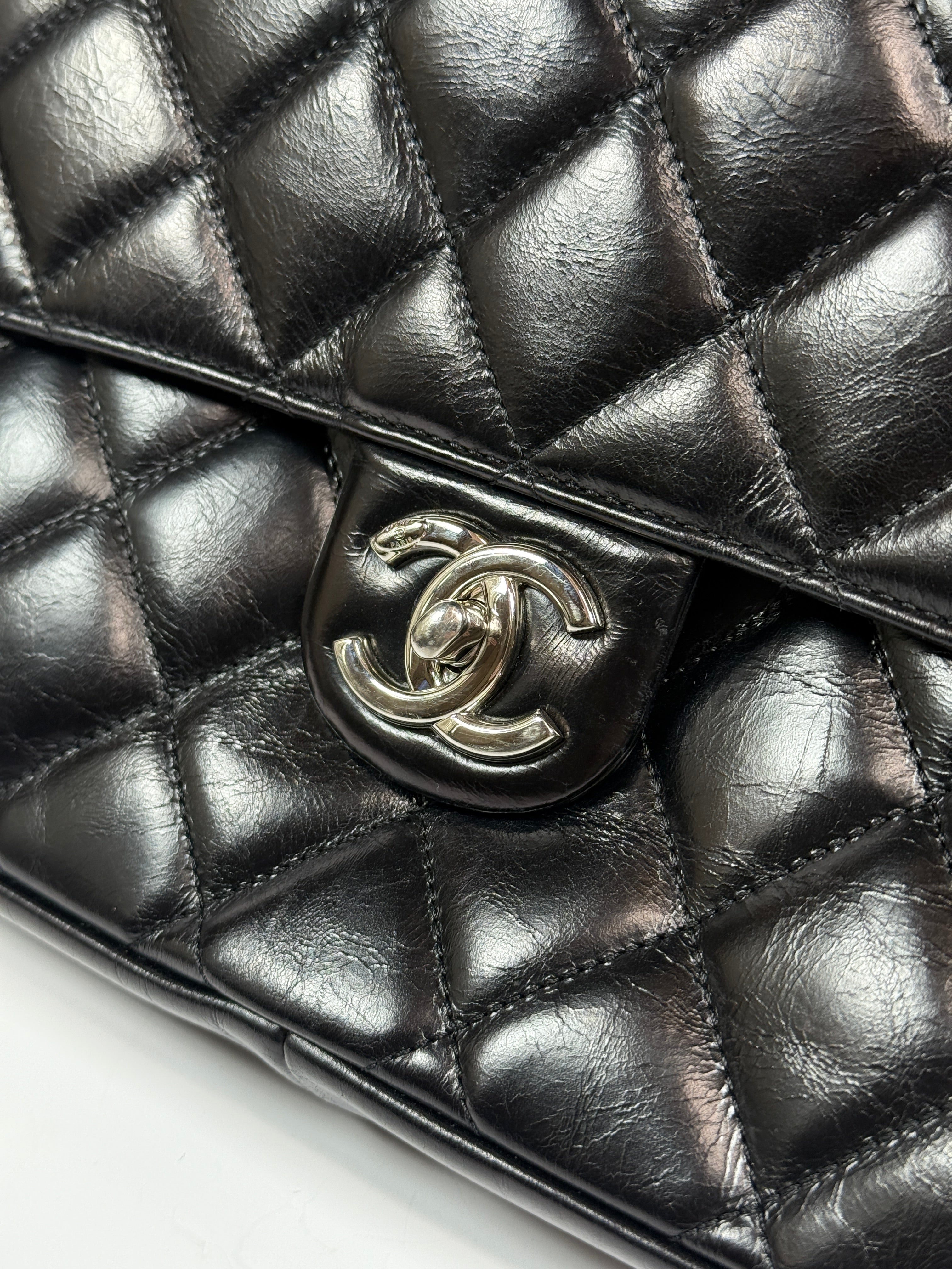 Chanel Delivery Top Handle Flap Bag In Black Calfskin Leather With Silver hardware in very good condition Authentic and preloved 