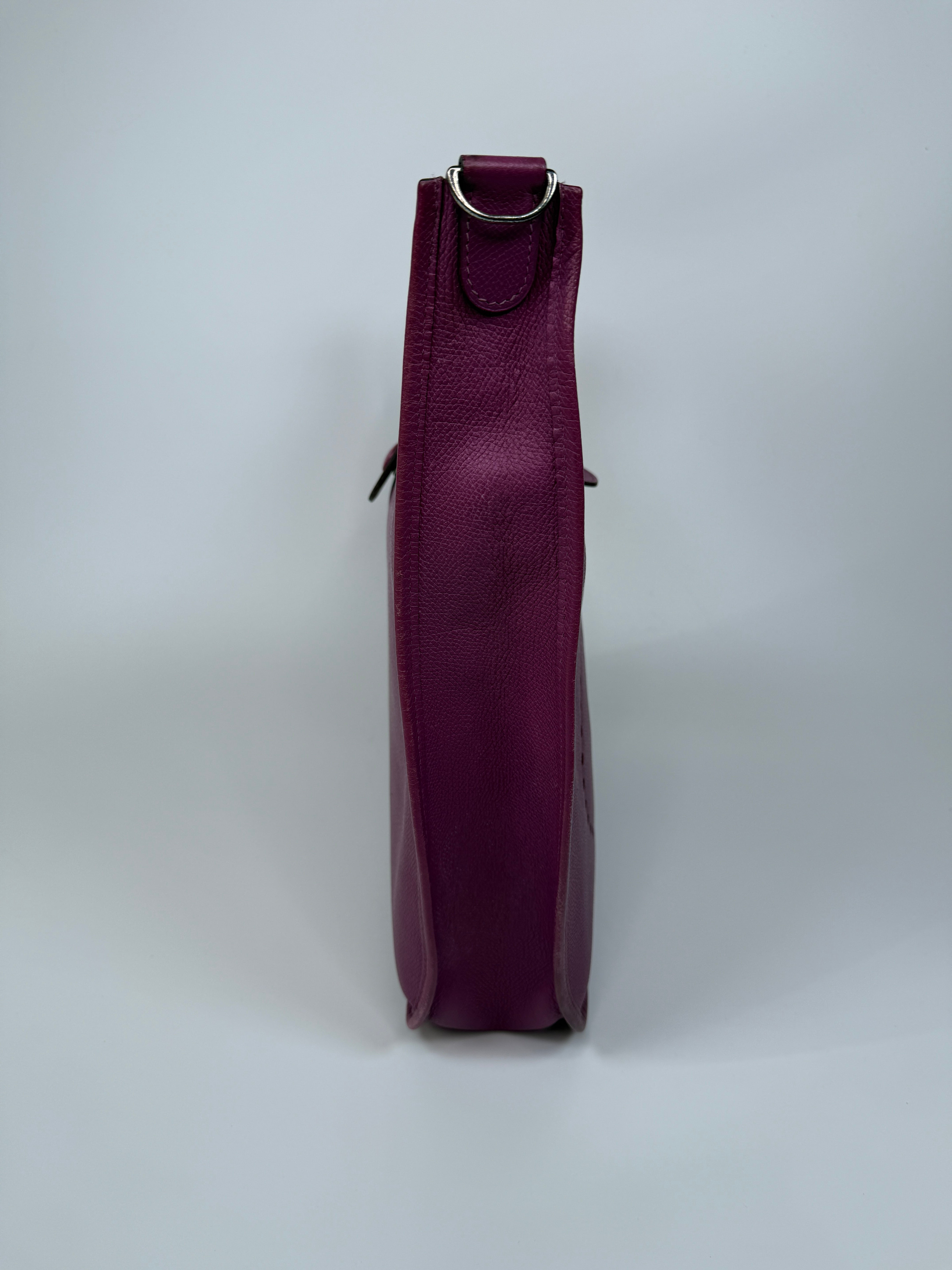 Authentic and preloved Hermès Evelyne 29 In Purple Clemence Leather With Palladium Hardware. Good Condition. 100% Authenticity Guarantee 