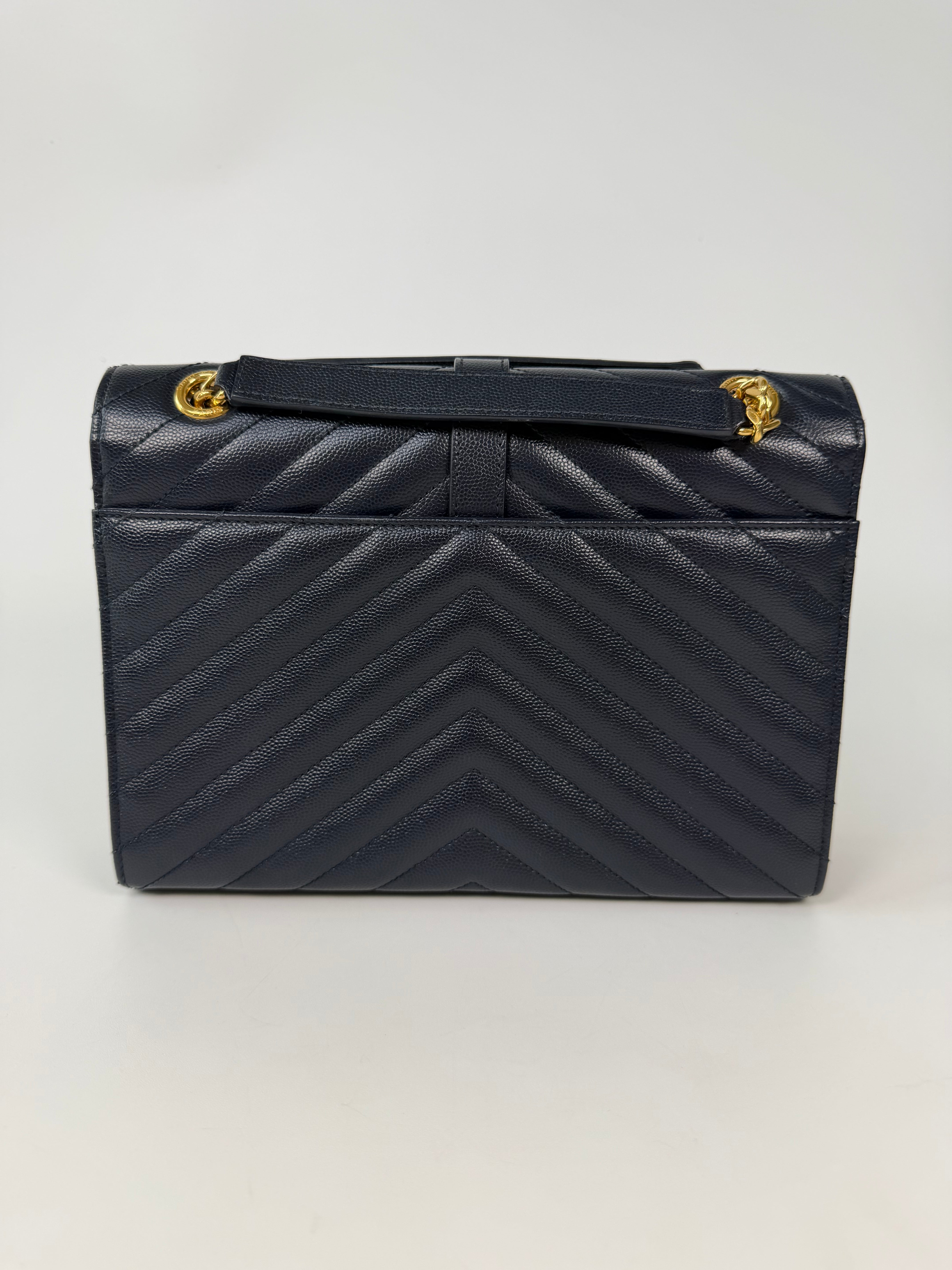 Authentic and pre loved Saint Laurent Medium Envelope Bag In Blue Grained Leather With Gold Hardware. Excellent Condition. Verified by Luxe Cheshire 