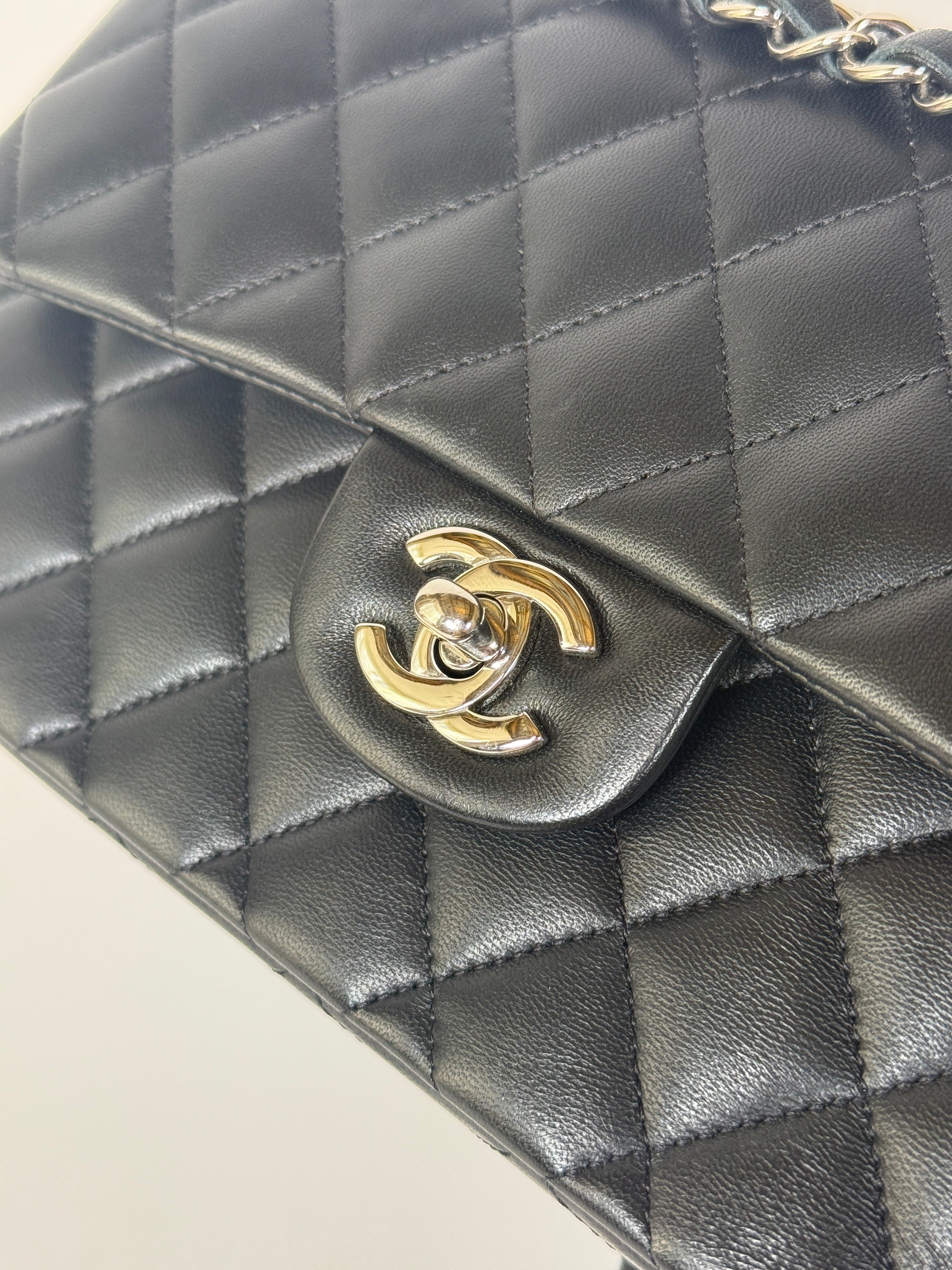 Authentic and preloved Chanel Small Classic Double Flap In Black Lambskin Leather With Silver hardware 100% Authenticity guarantee
