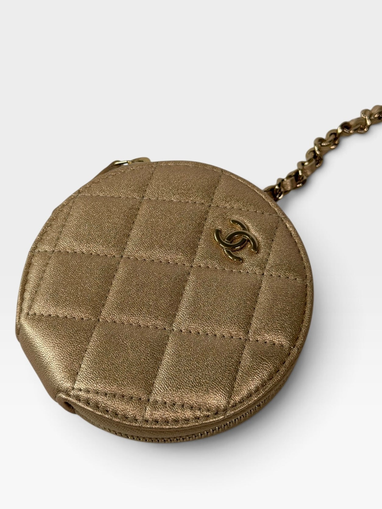 Chanel Round Purse and AirPods Case In Metallic Gold Lambskin. 100% authentic and preloved in excellent condition.