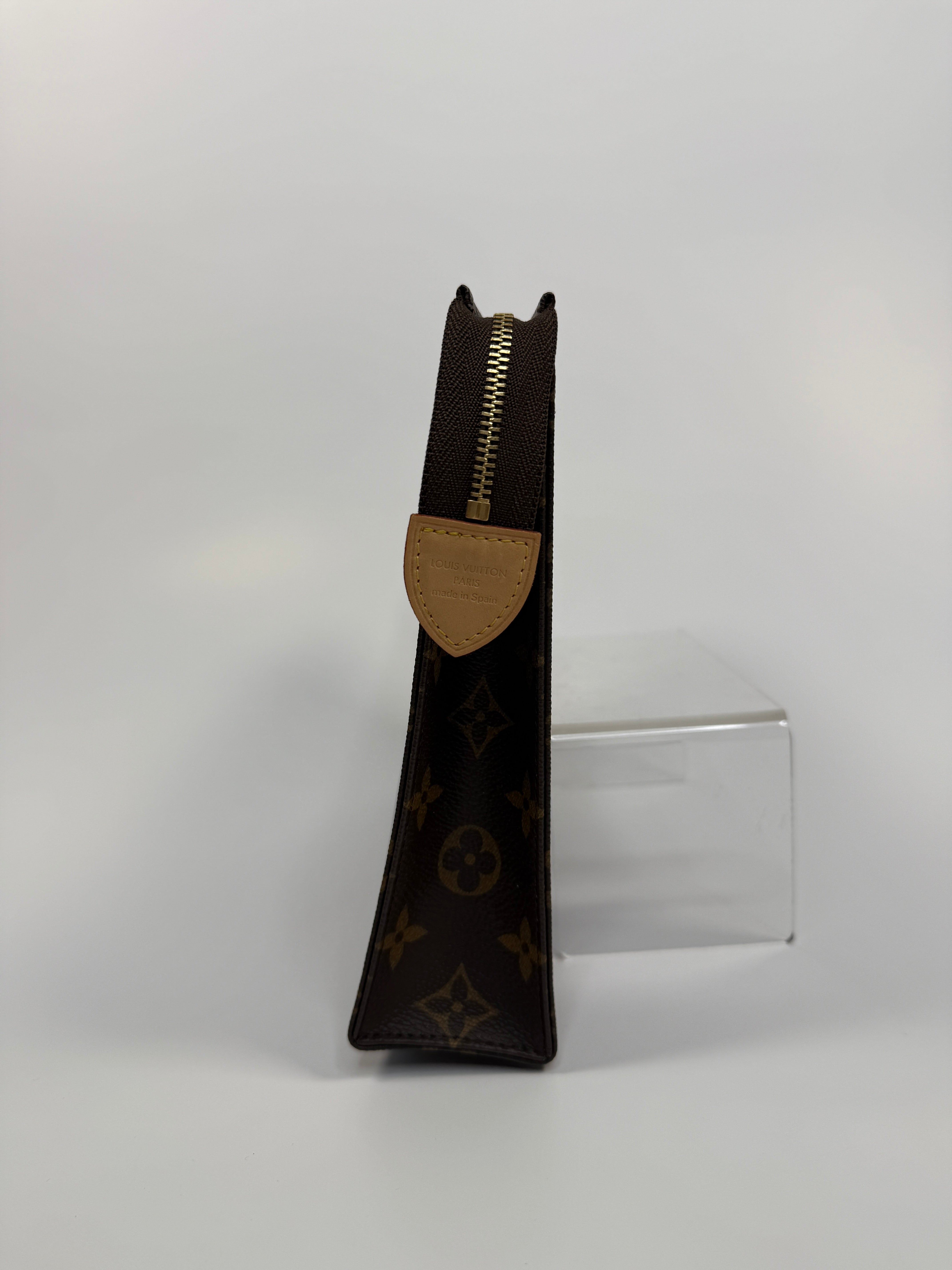 Authentic and preloved Louis Vuitton Monogram Toiletry 26 Pouch In Brown Monogram With Gold Hardware in excellent condition