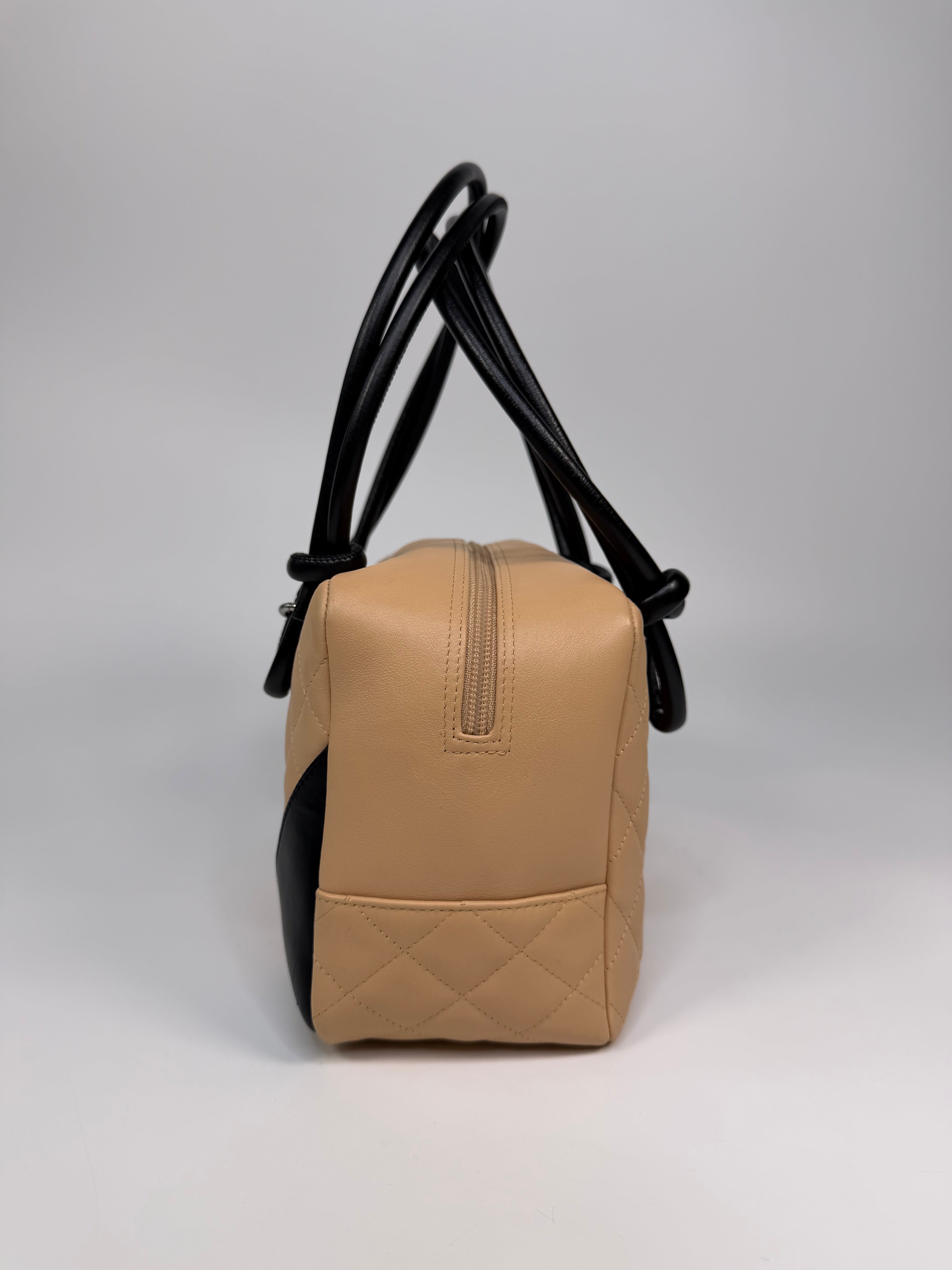 Chanel Cambon Bowling Bag In Beige / Black Leather With Silver Hardware. Authentic and preloved in excellent condition.