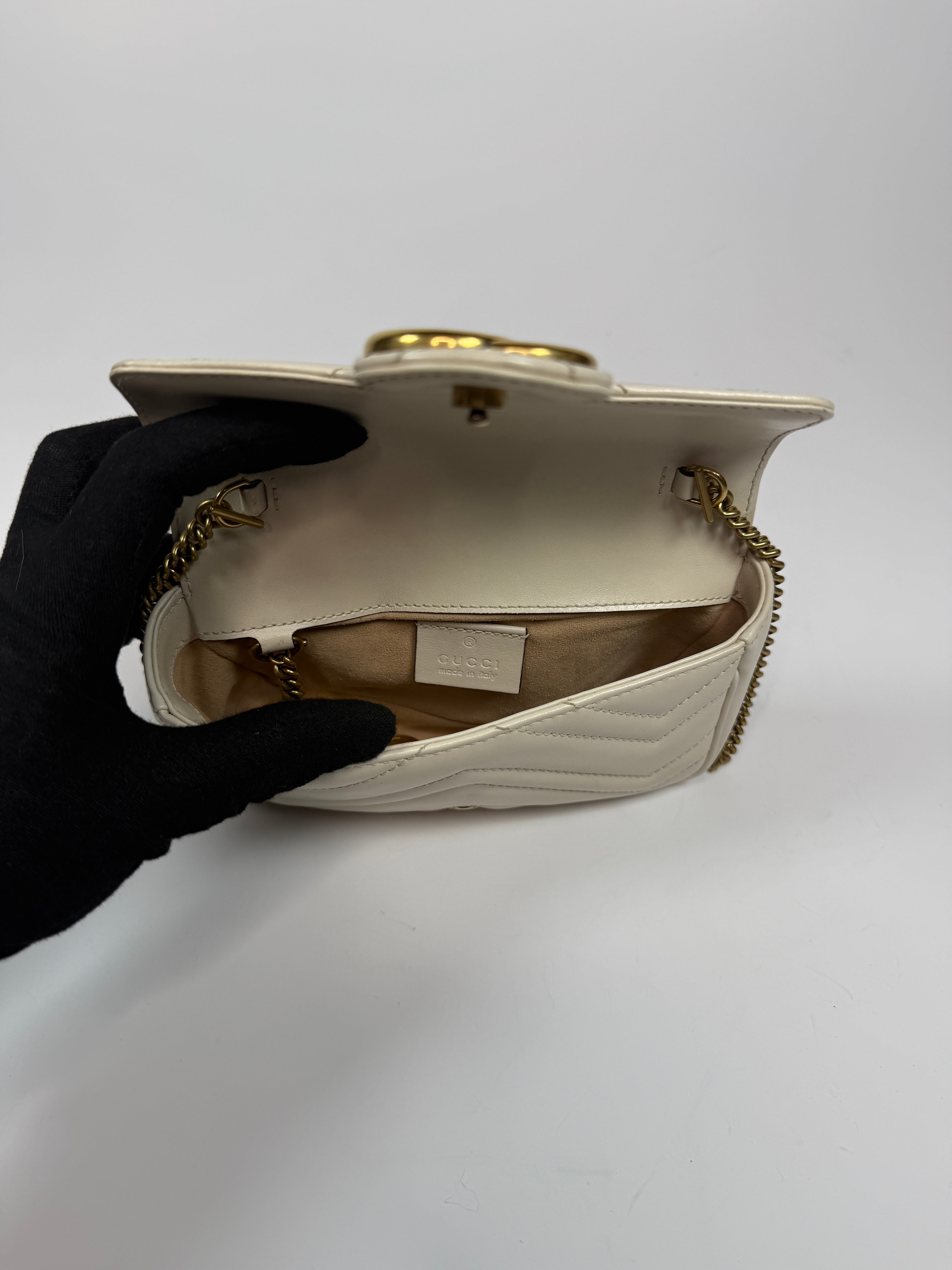 Gucci Marmont White  Matelassé Super Mini Bag With Gold Hardware In Excellent pre loved condition. Authentic and preloved