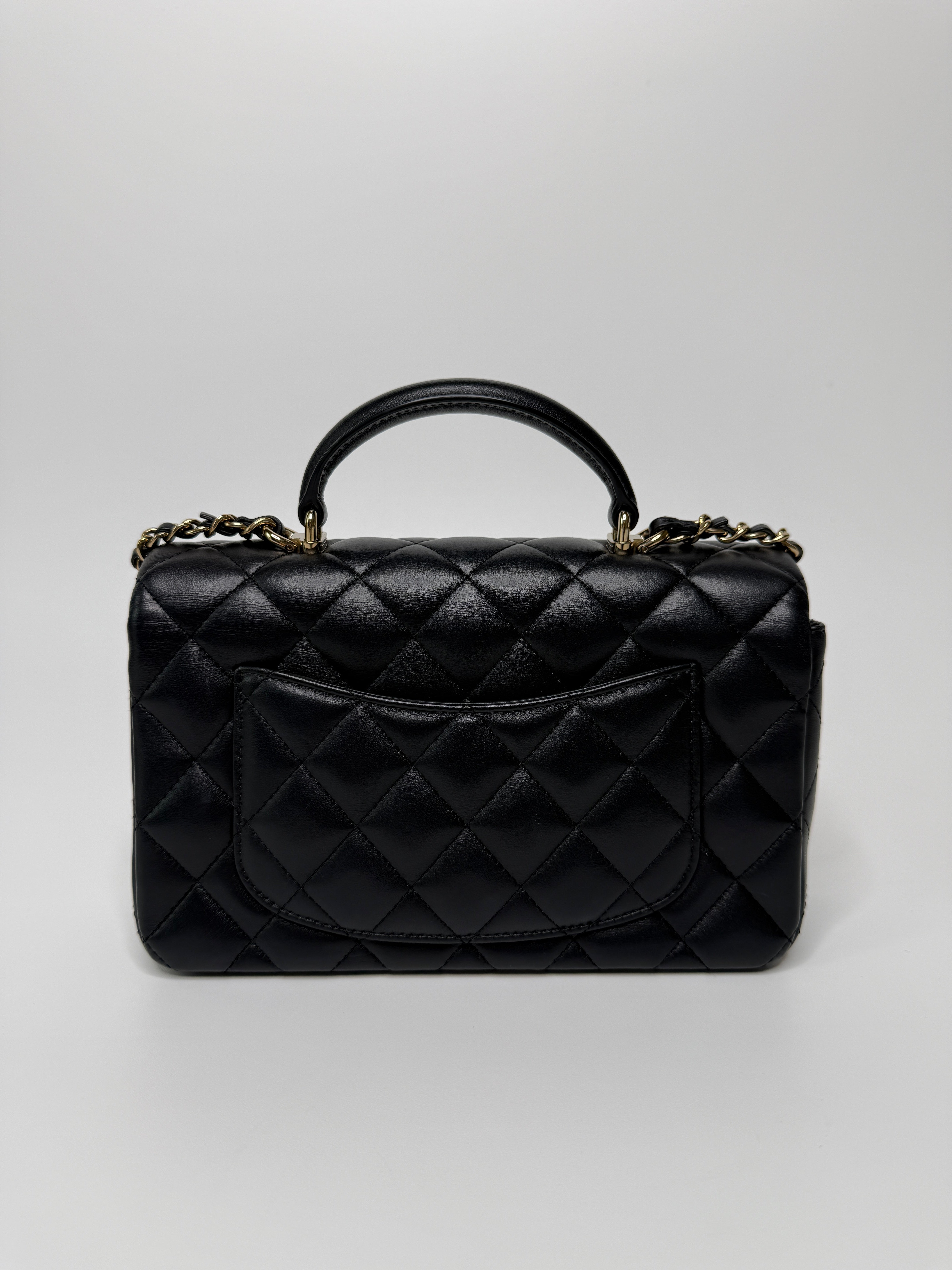 Chanel Mini Rectangle Top Handle Flap Bag In Black Lambskin With Pale Gold Hardware