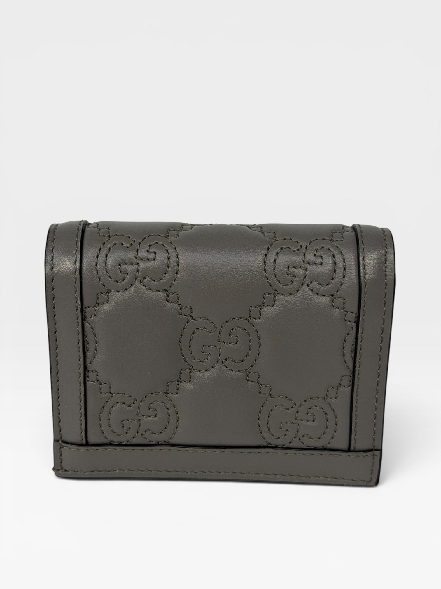Gucci GG Embossed Wallet In Grey Leather With Gold Hardware. Authentic and preloved in excellent condition.