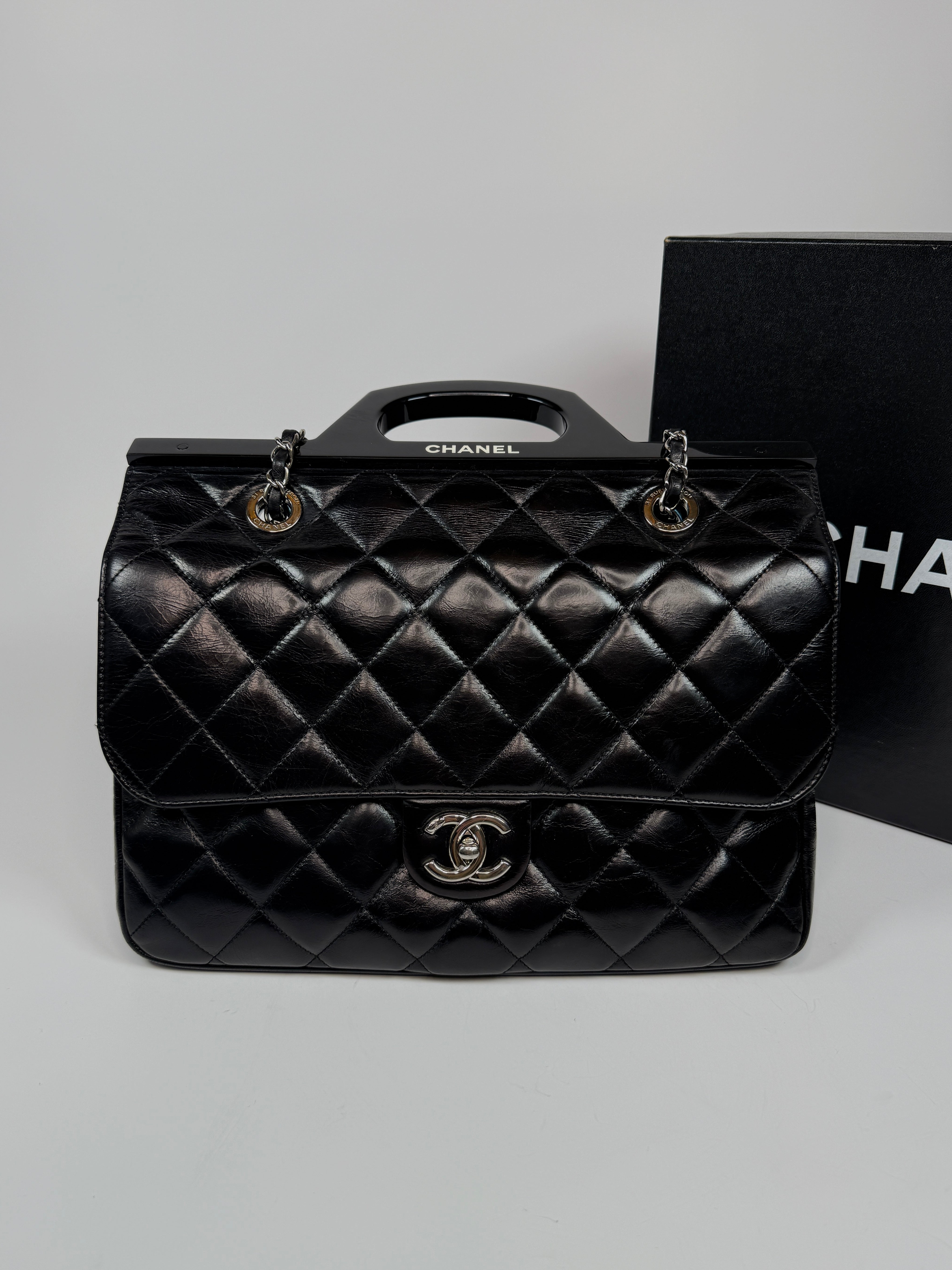 Chanel Delivery Top Handle Flap Bag In Black Calfskin Leather With Silver hardware in very good condition Authentic and preloved 