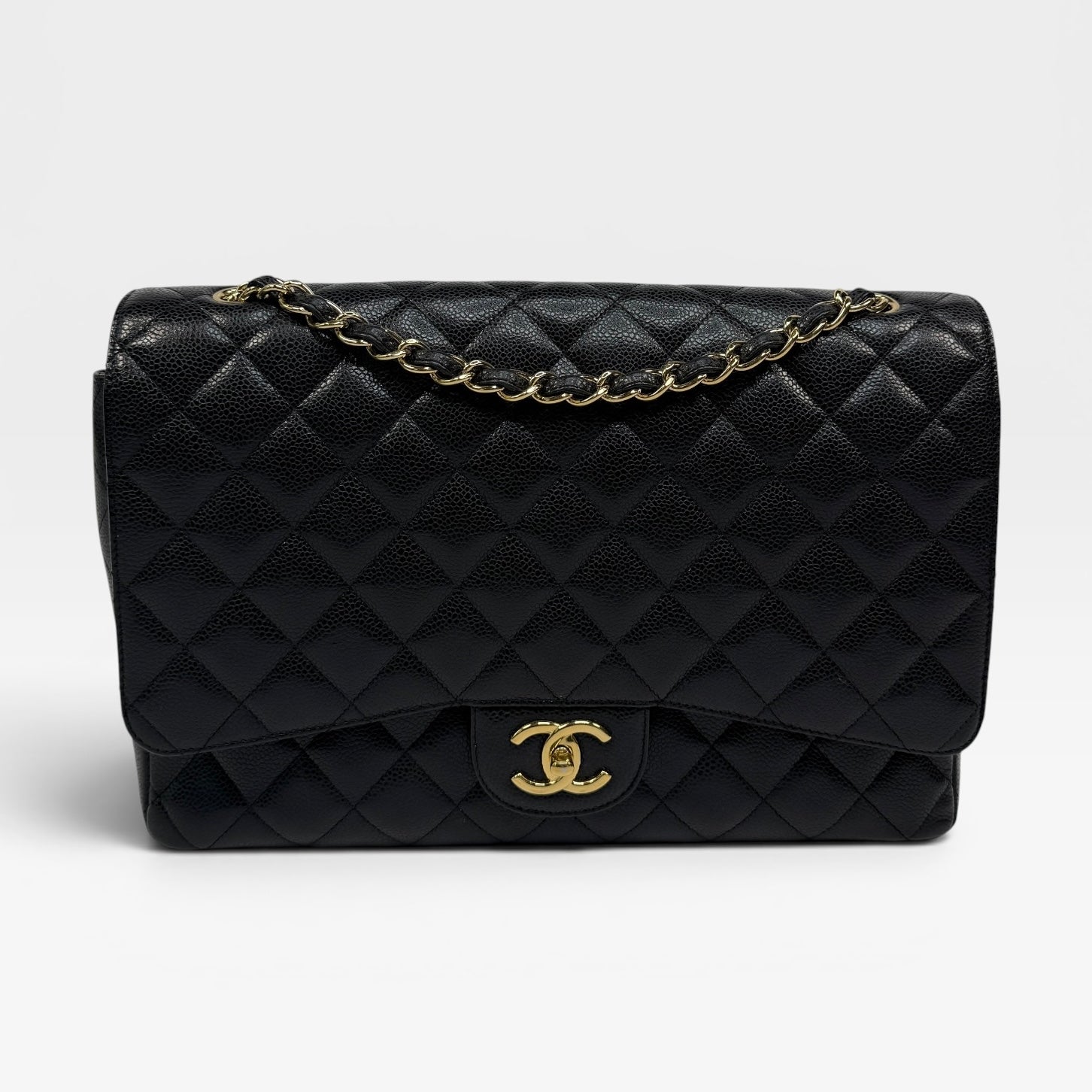 Chanel Maxi Classic Double Flap In Black Caviar Leather With Gold Hardware