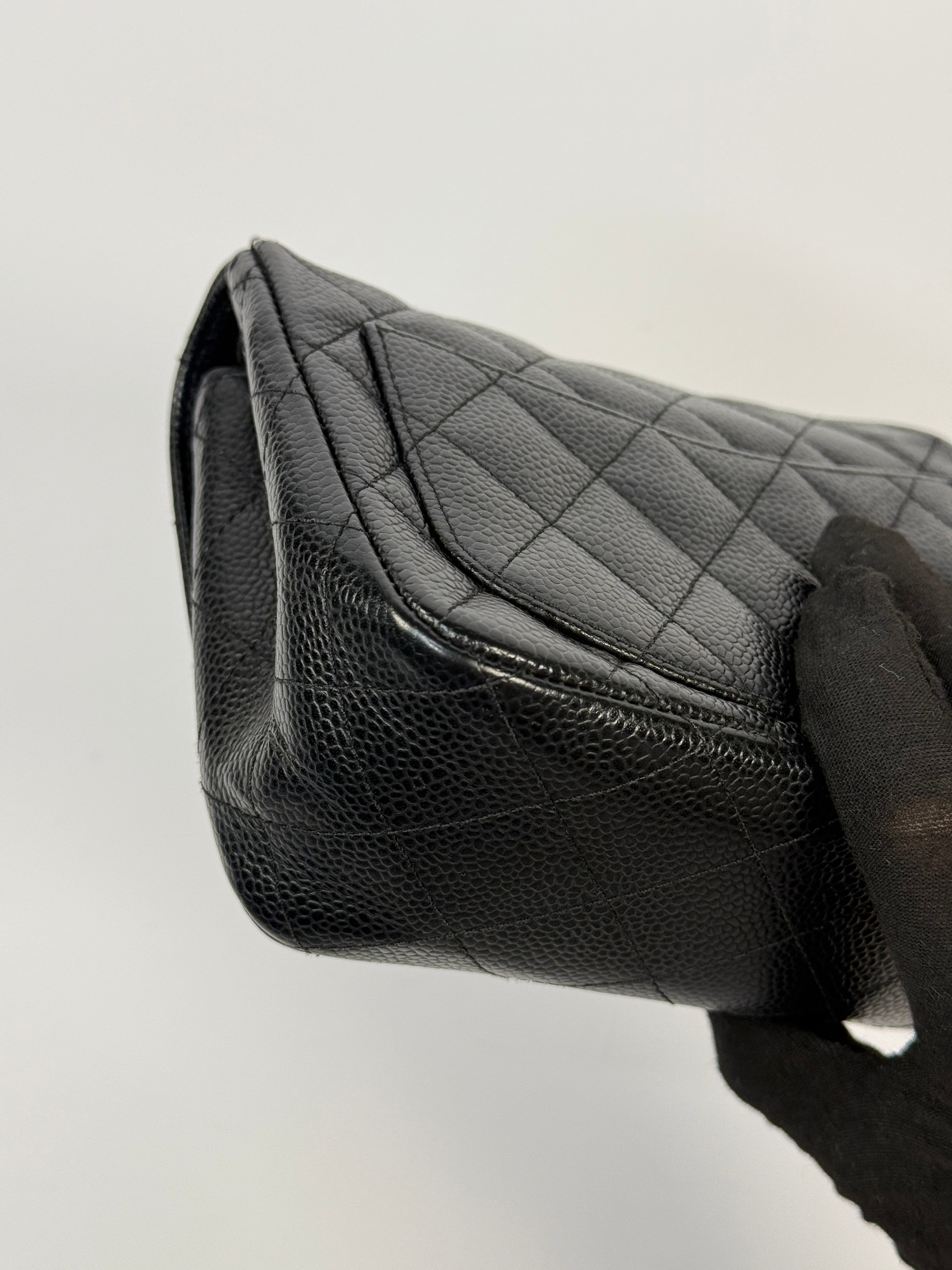 Chanel Black Square Flap Bag In Black Caviar Leather With Silver Hardware. Excellent condition. Authentic and preloved.