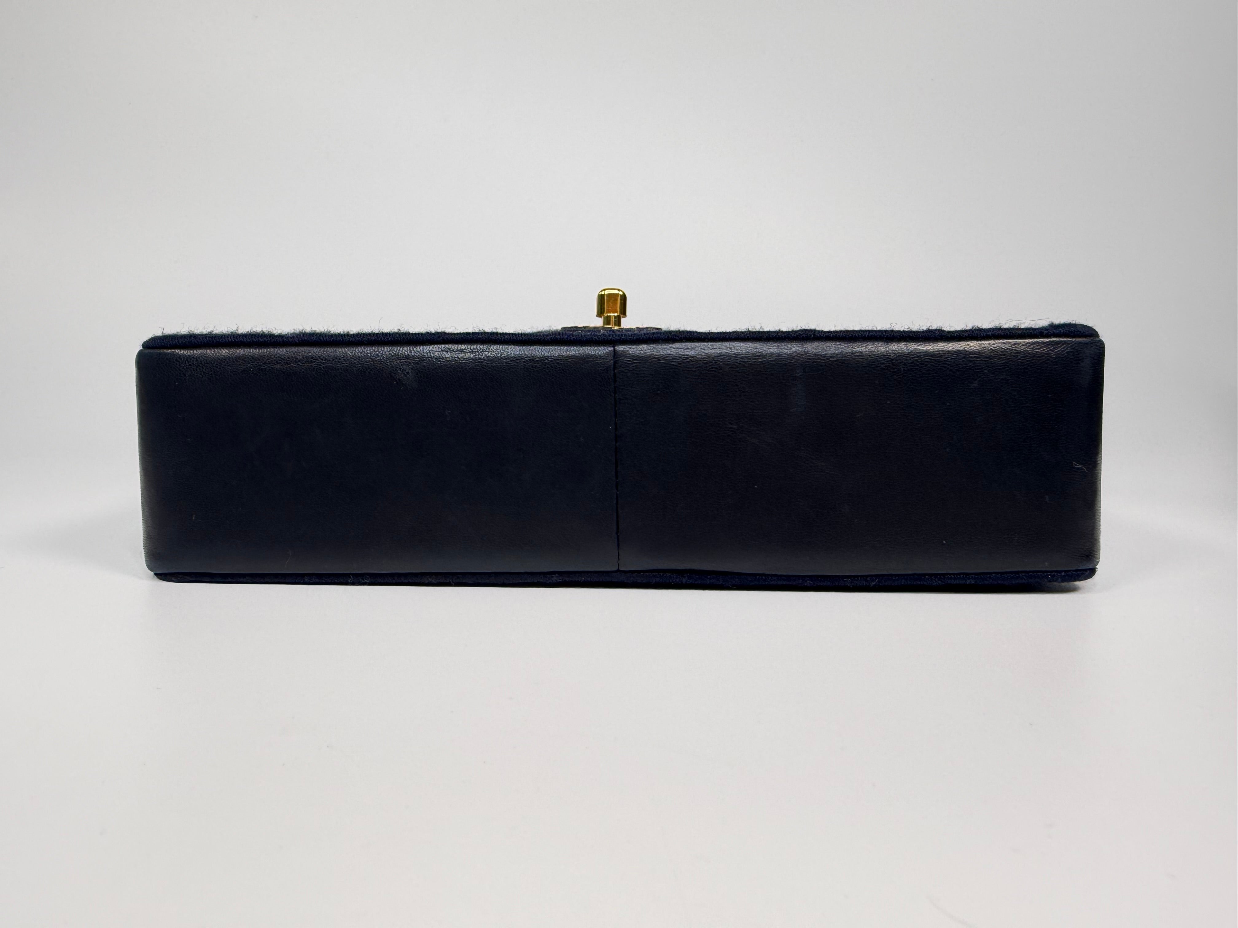 Chanel Vintage Medium Double Flap Navy Cotton With 24Kt Gold Hardware. Authentic and preloved in excellent condition.