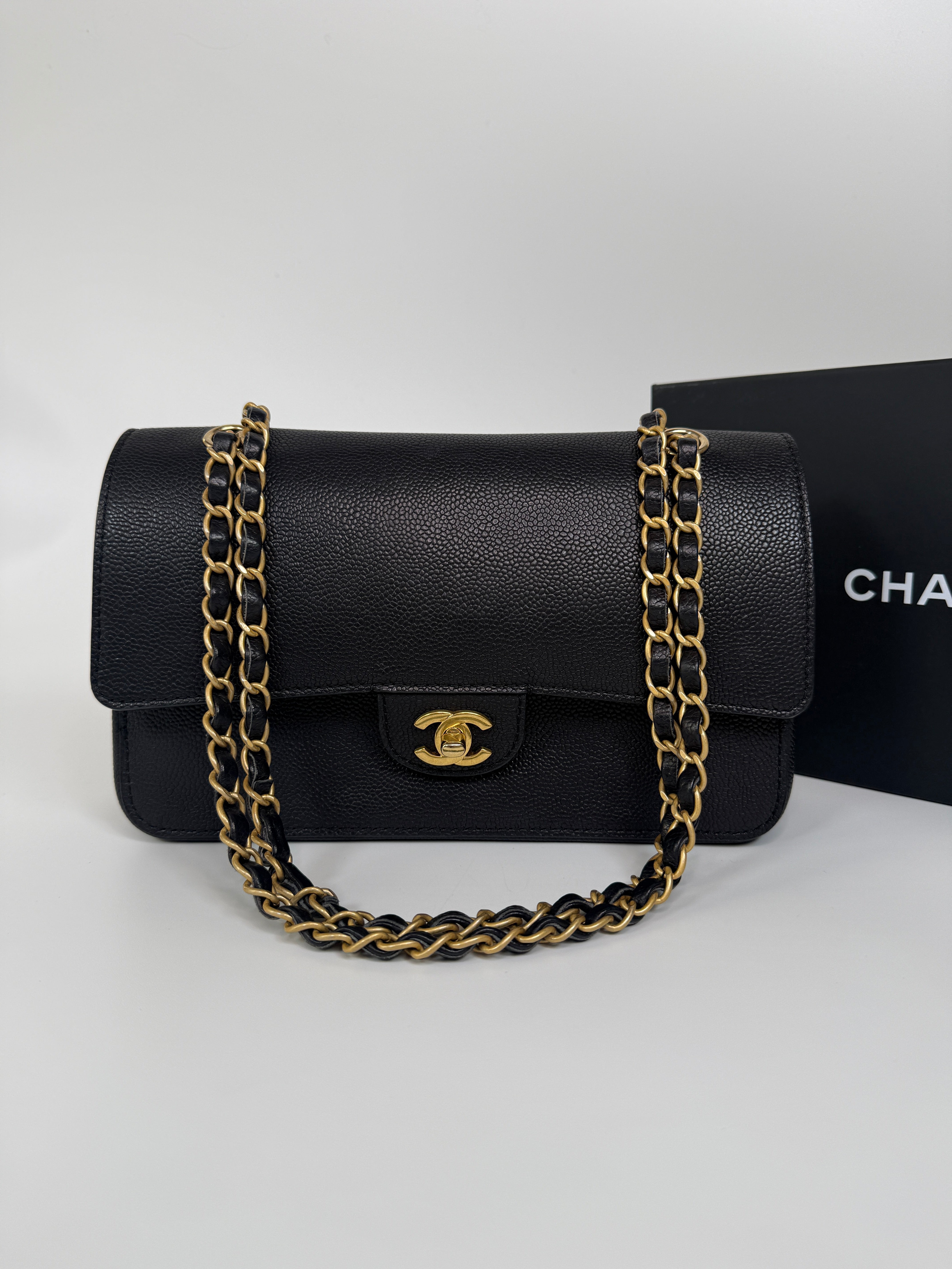 Authentic and preloved Chanel Medium Pure Timeless Flap Black In Black Caviar Leather With Gold Hardware. 100% Authenticity Guarantee 