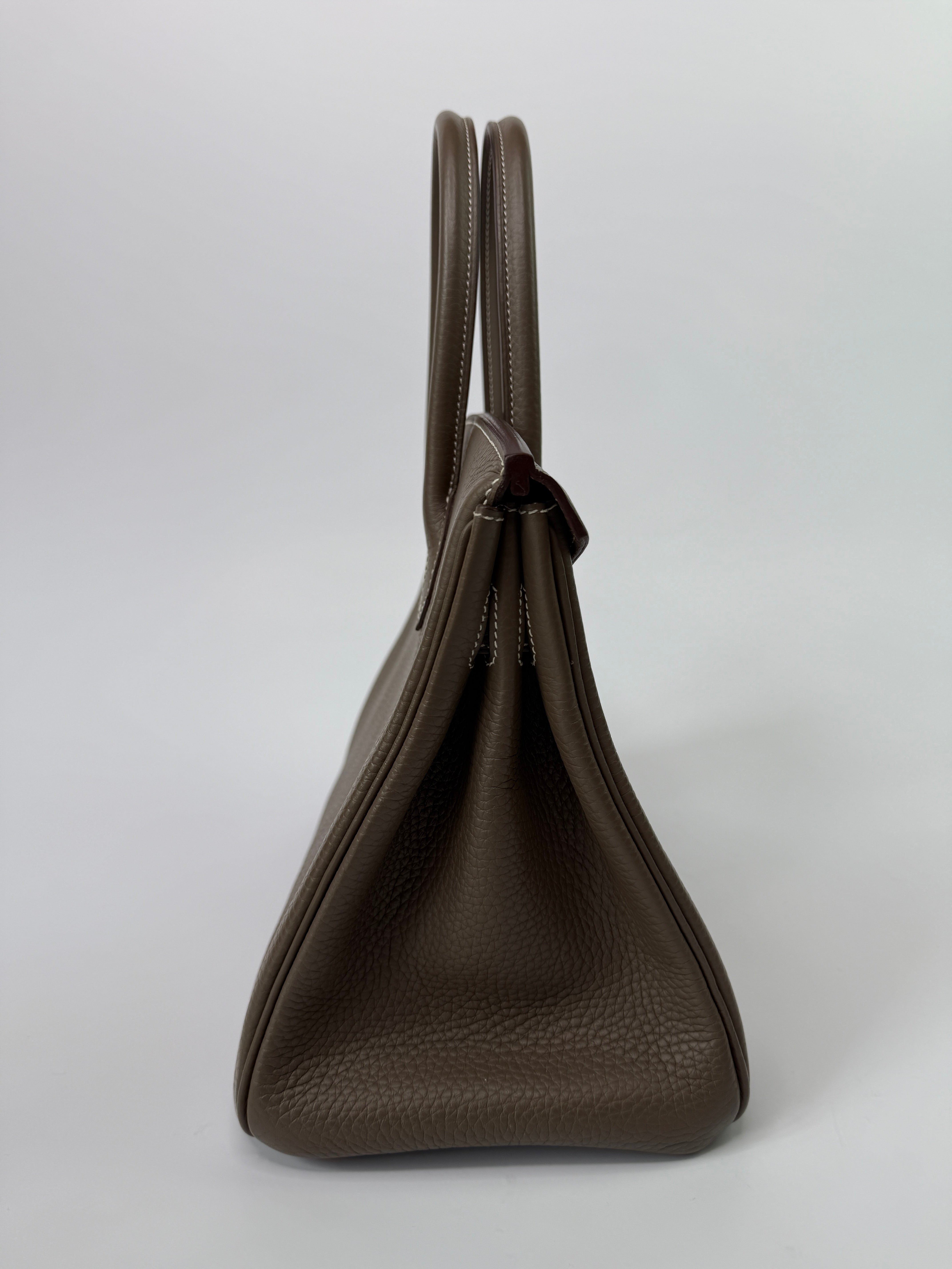 Authentic pre-loved Hermès Birkin 30 In Etoupe Togo Leather With Gold Hardware.