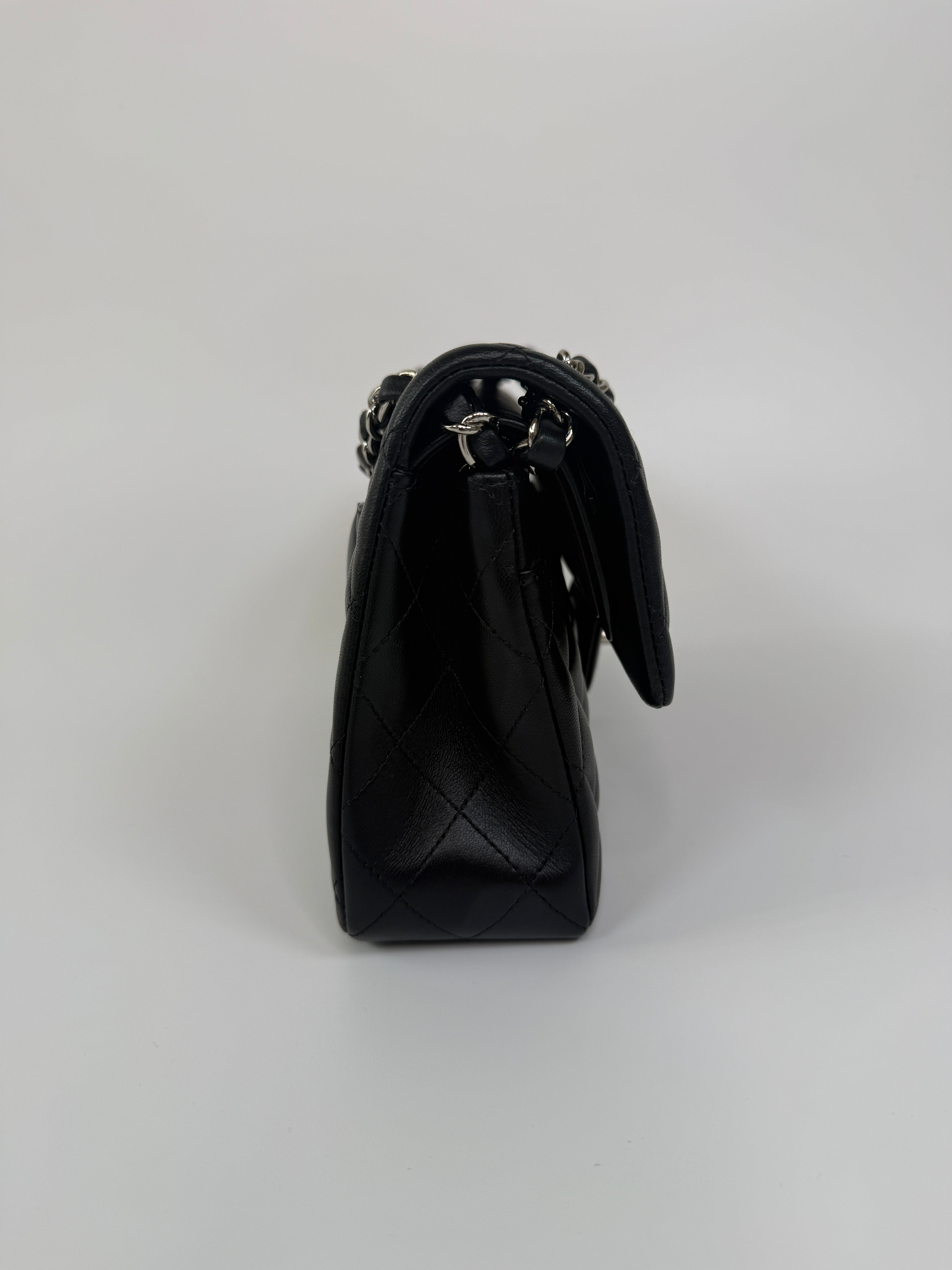 Chanel Small Classic Double Flap In Black Lambskin Leather With Silver Hardware Authentic and preloved in excellent condition. 100% Authenticity guarantee