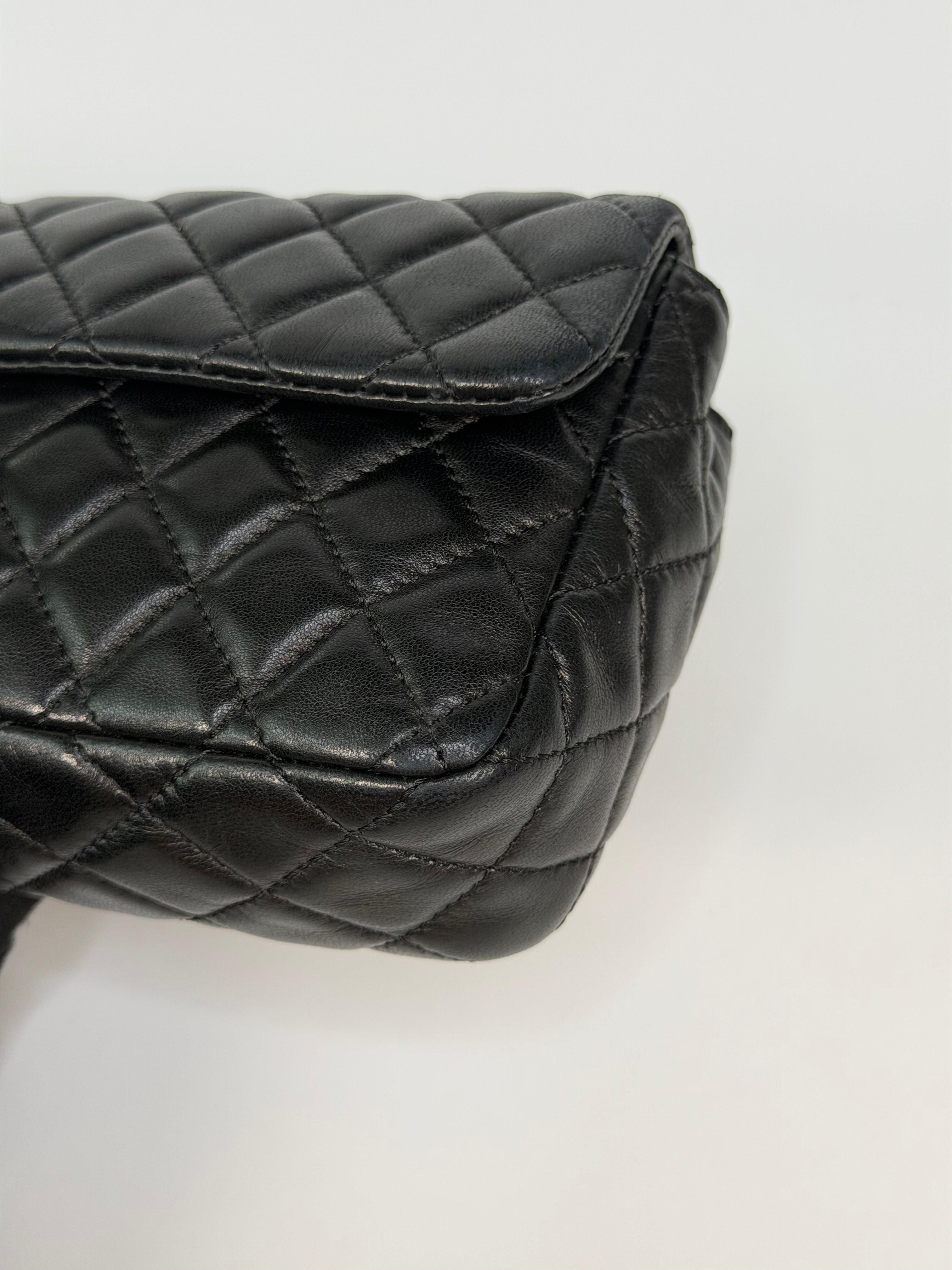 Chanel East West Charms Bag In Black Lambskin Leather With Gold Hardware. Authentic and preloved in excellent condition. 100% guarantee