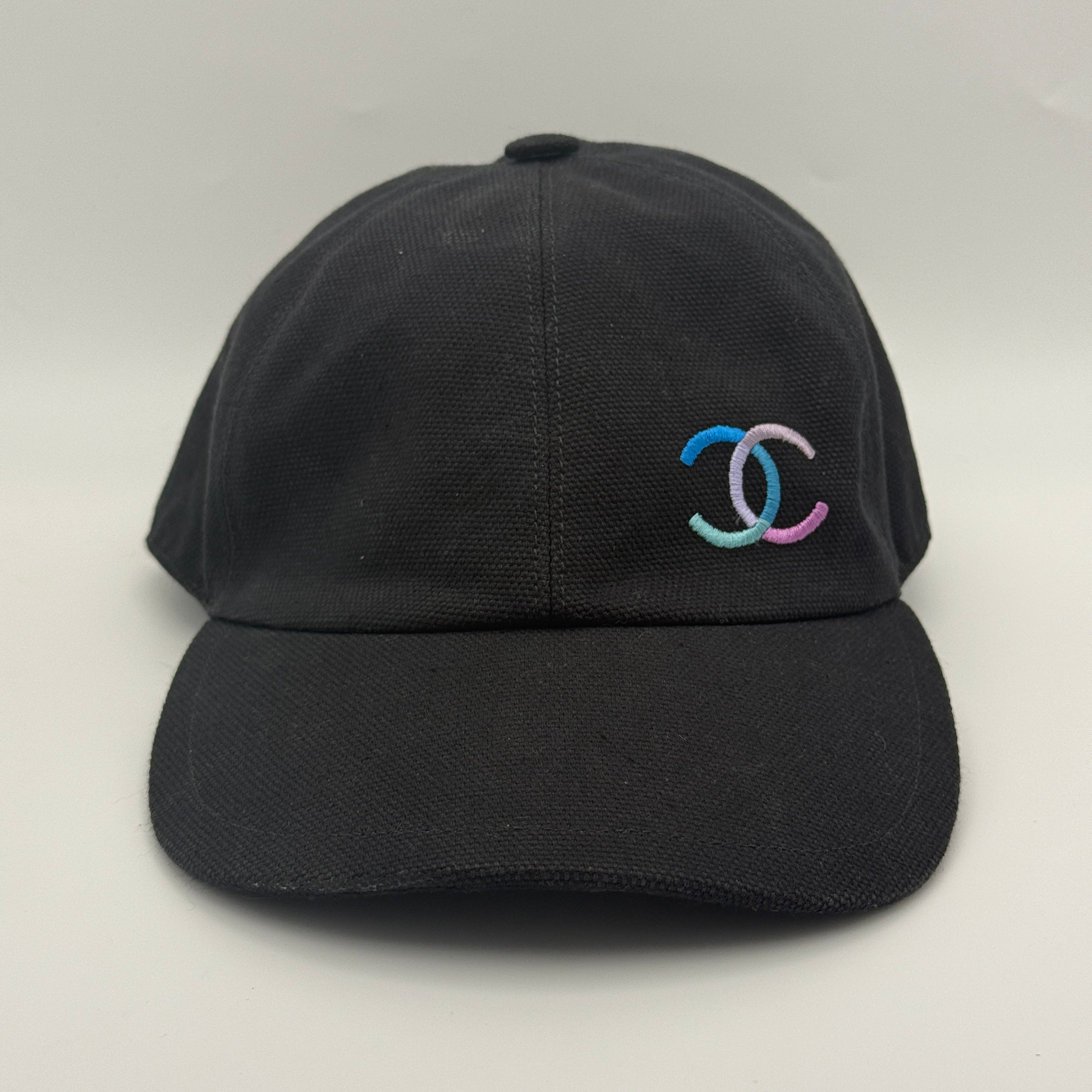 chanel cc cap black with multi coloured logo Authentic and preloved In Very Good Condition. 100% Authenticity Guarantee 