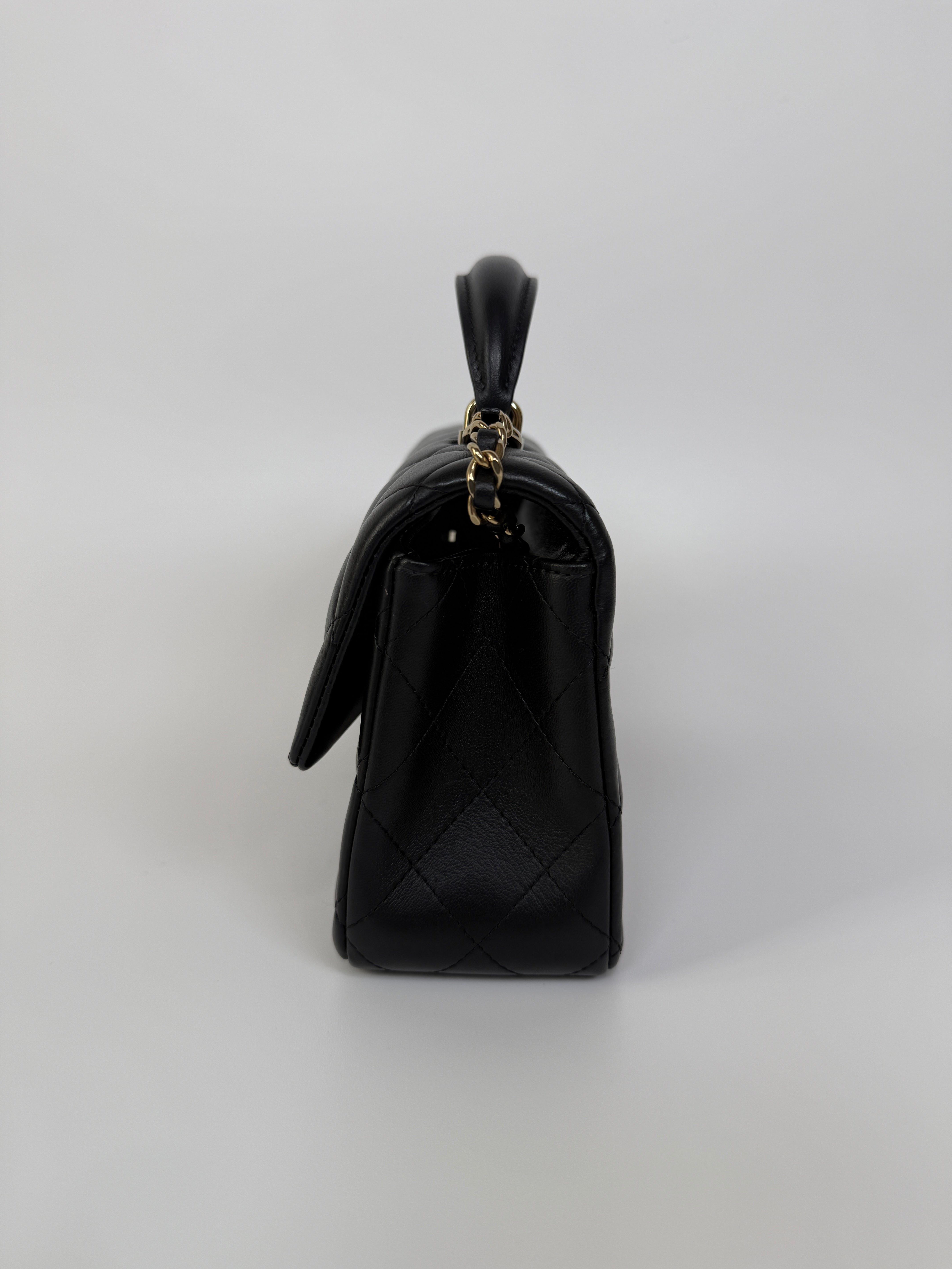 Authentic and preloved Chanel Mini Rectangle Top Handle Flap Bag In Black Lambskin With Gold hardware. Excellent Condition. 100% Authenticity guarantee 