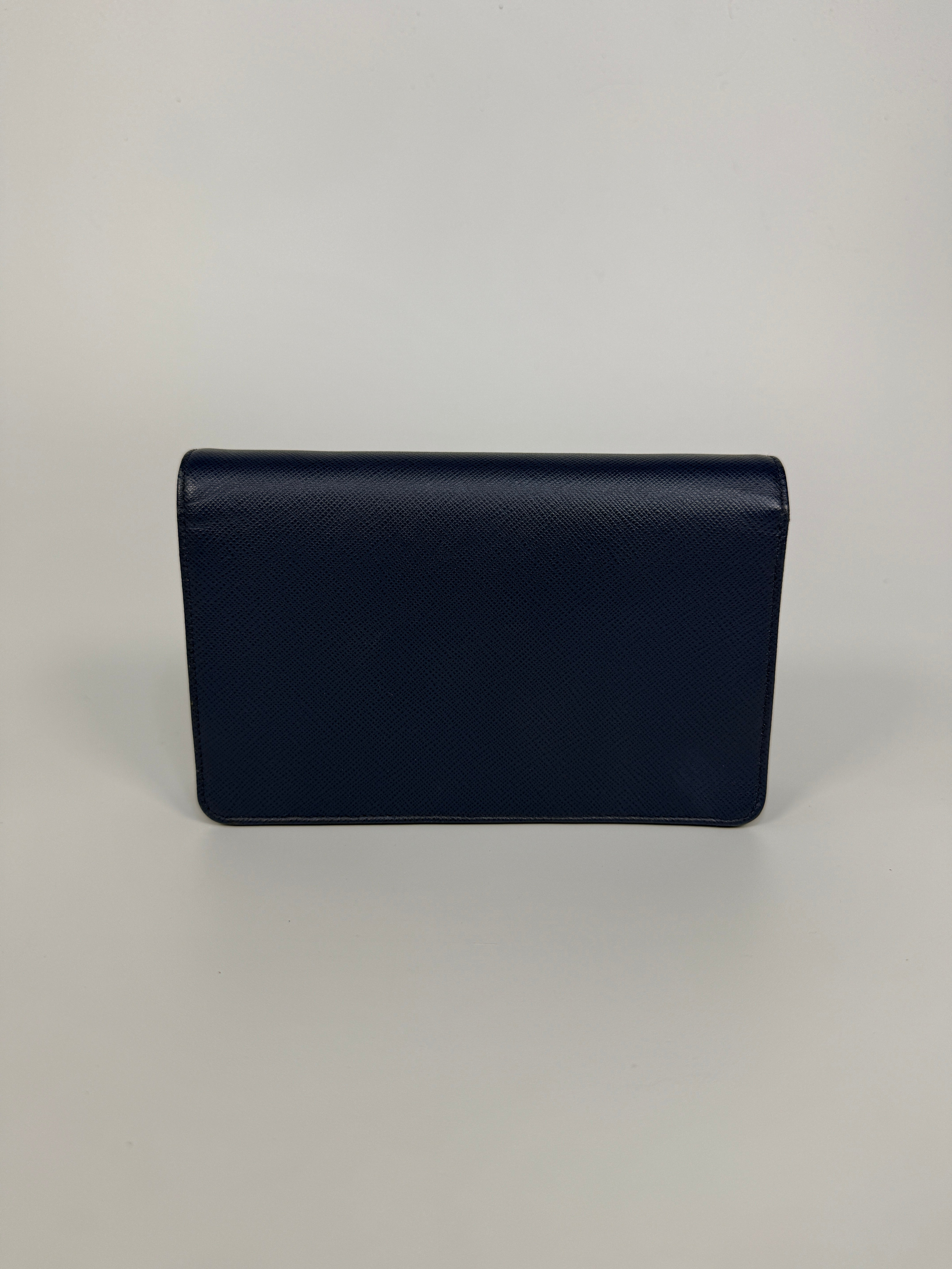 Authentic and preloved Prada Wallet Chain Bag In Blue Saffiano Leather With Gold Hardware. Very Good condition. 100% Authenticity guarantee 