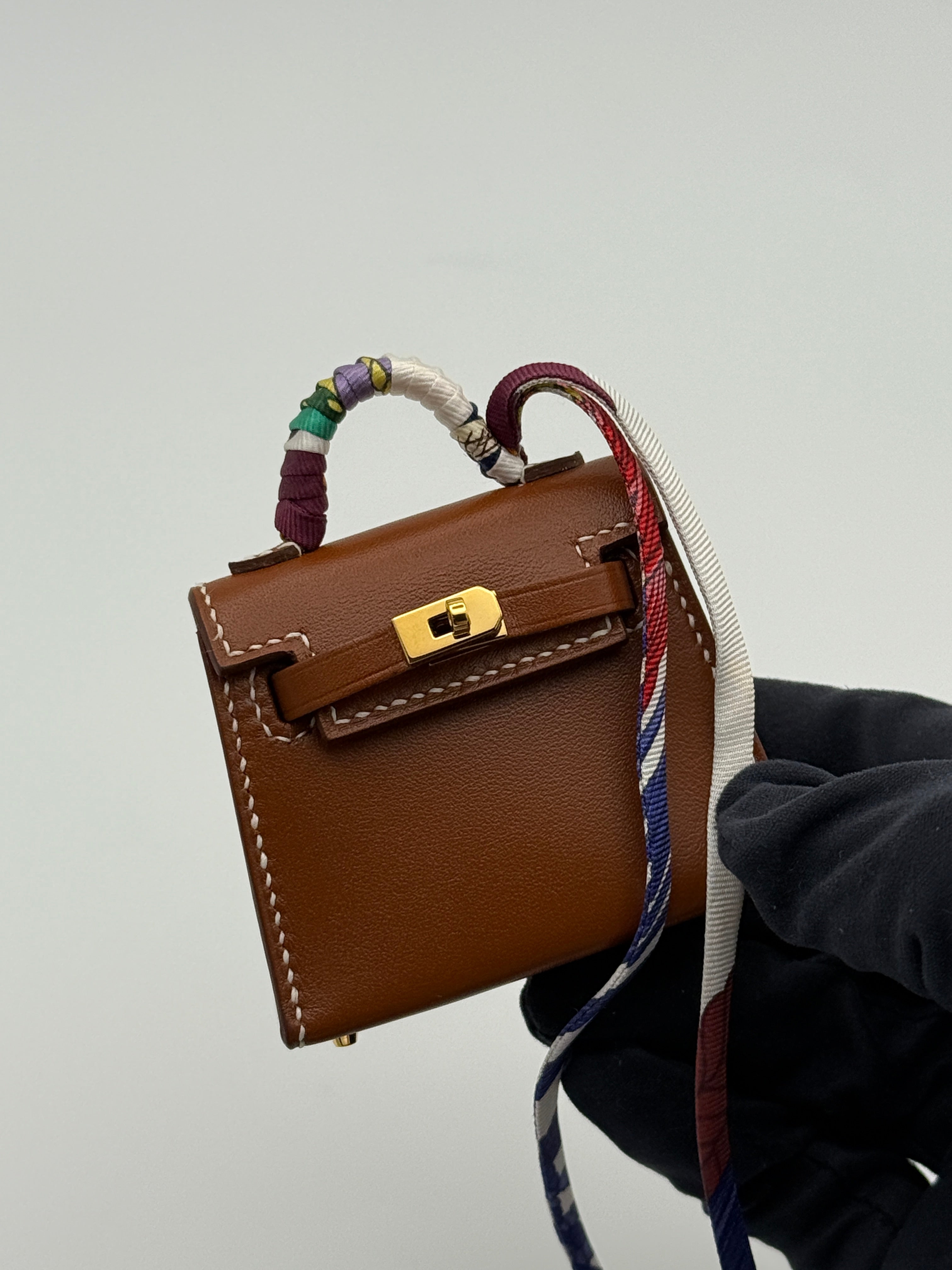Hermès Kelly Twilly Charm In Gold Tadelakt Leather With GHW