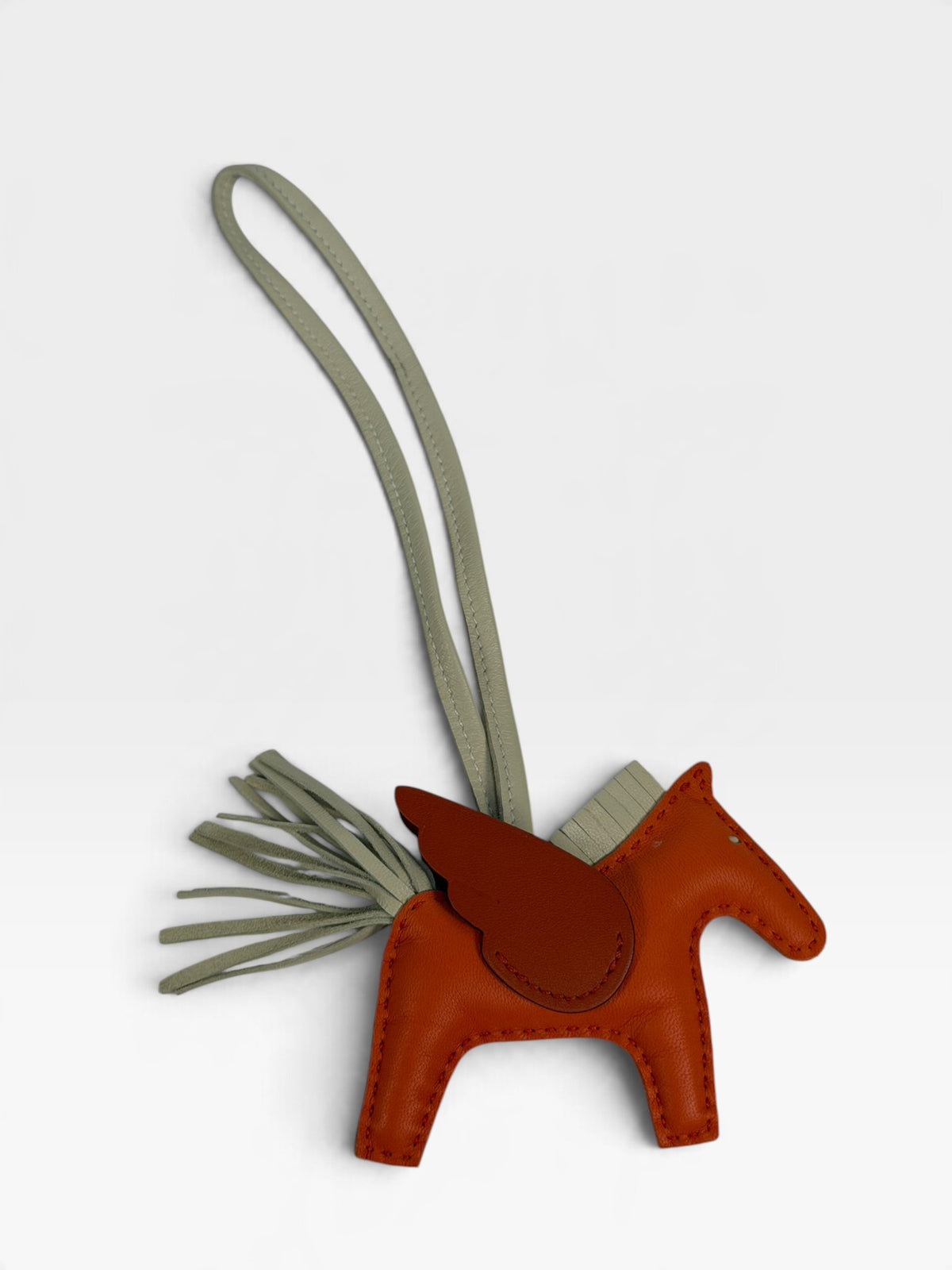 Hermès Rodeo Pegasus Charm In Orange Poppy, Craie & Terre Battue. 100% authentic and pre loved in excellent condition. 