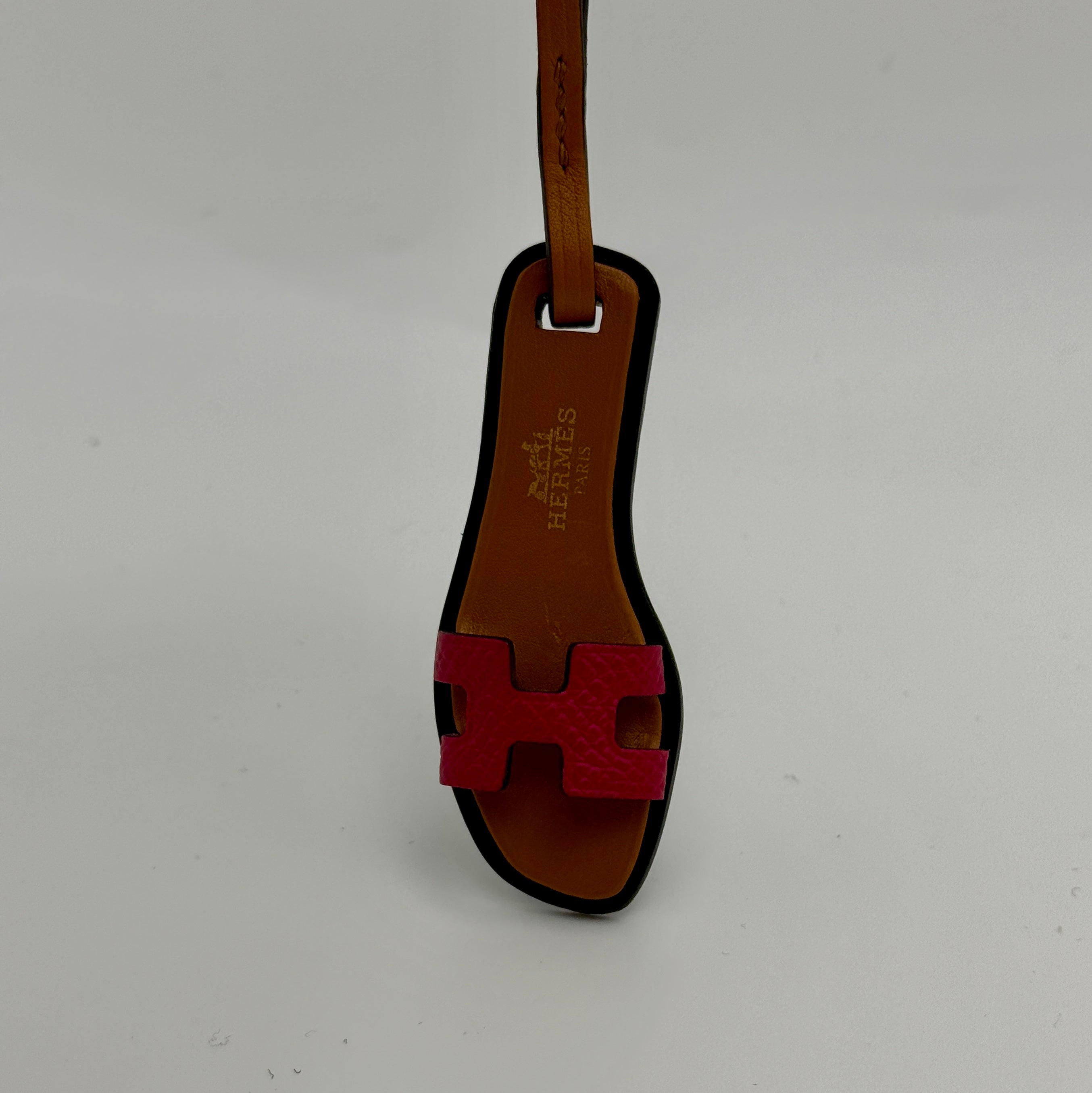 Hermes Oran Nano Bag Charm in Framboise/Natural Sable. Very Good Condition. Authentic and preloved 