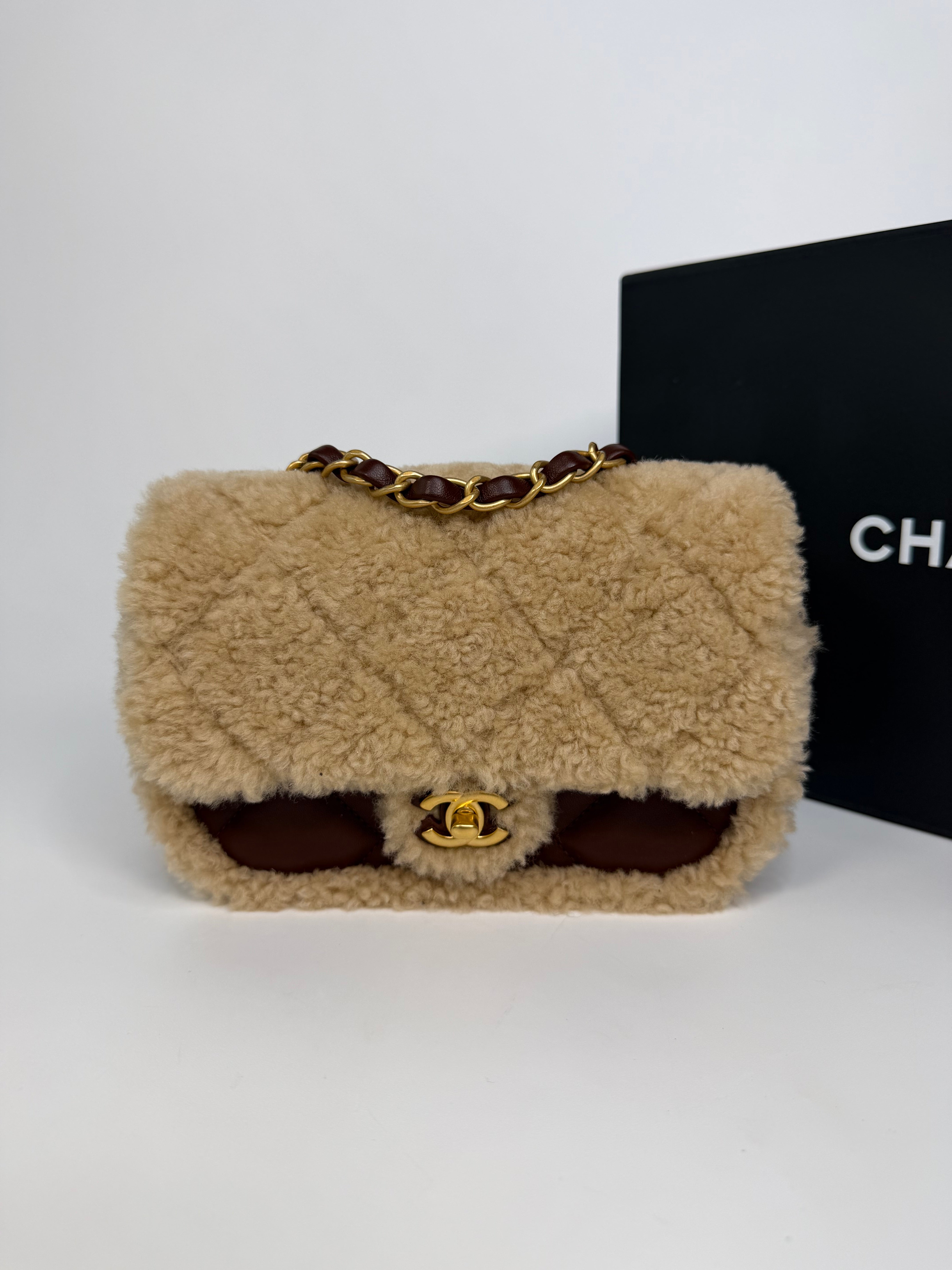 Chanel Mini Rectangle In Brown Lambskin Leather & Shearling With Gold Hardware. Authentic and preloved in excellent condition with 100% authenticity guarantee.