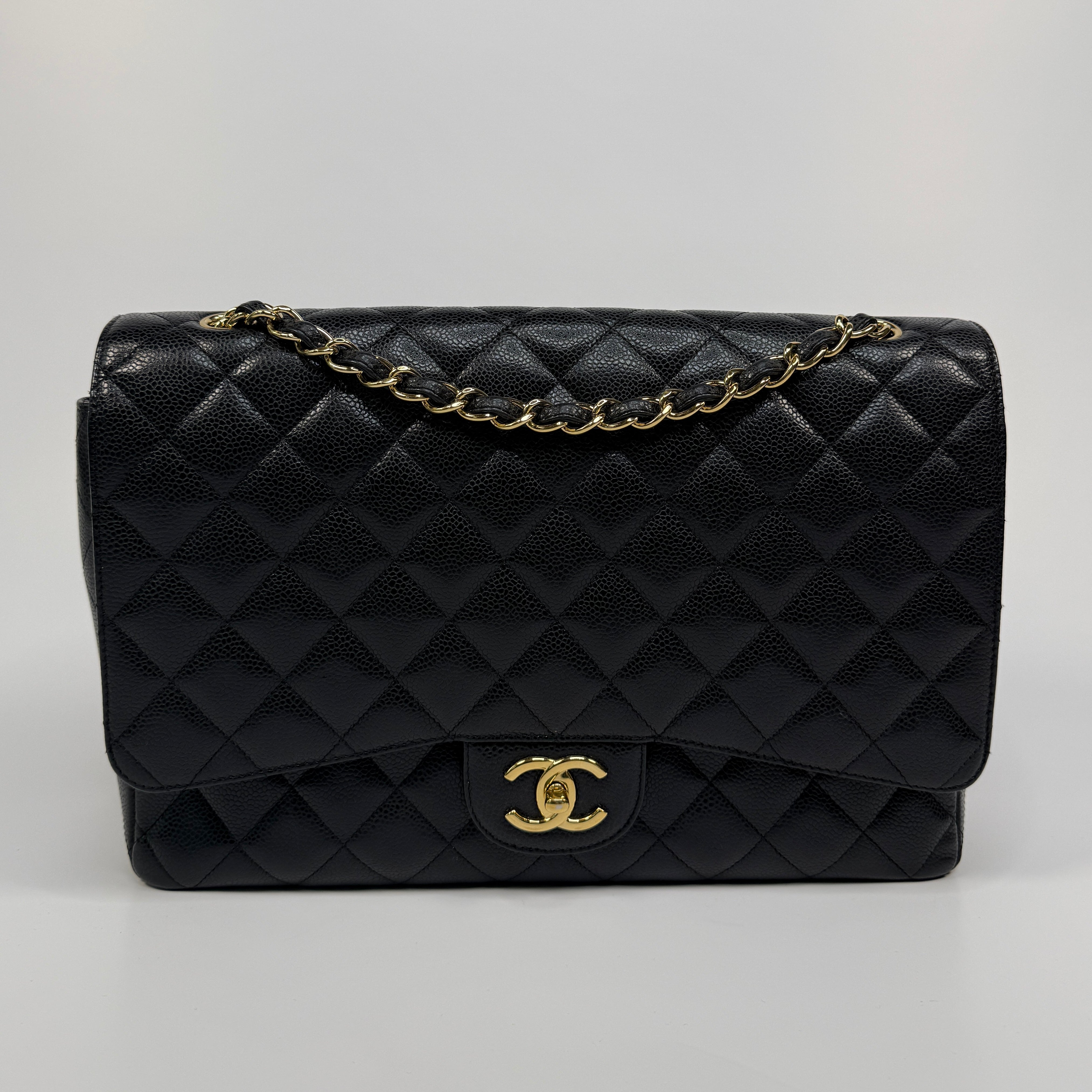 Chanel Maxi Classic Double Flap In Black Caviar Leather With Gold Hardware
Pre Loved & Authentic 