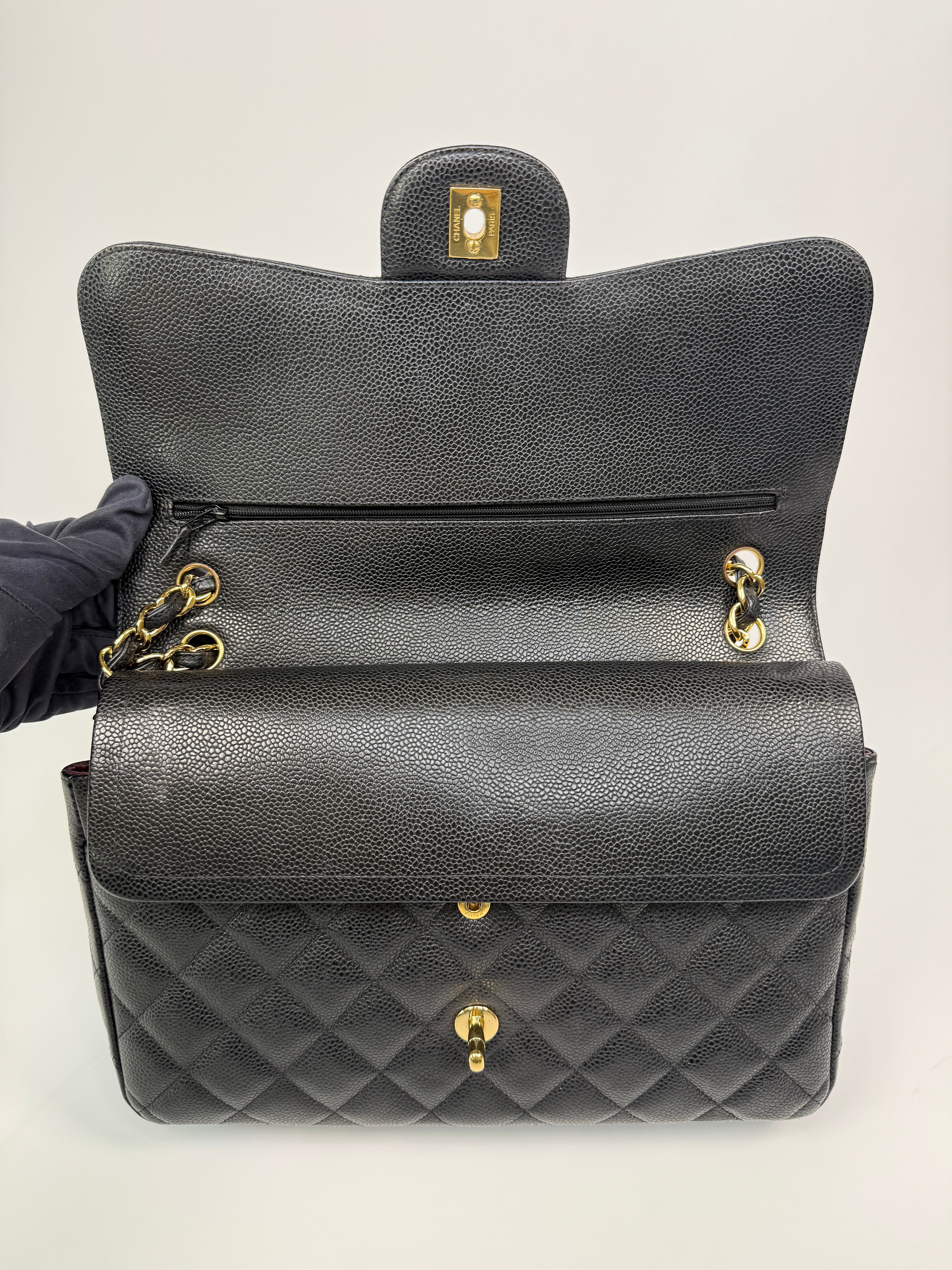 Chanel Classic Jumbo Flap Bag In Black Caviar LeatherWith Gold Hardware
Pre Loved & Authentic 