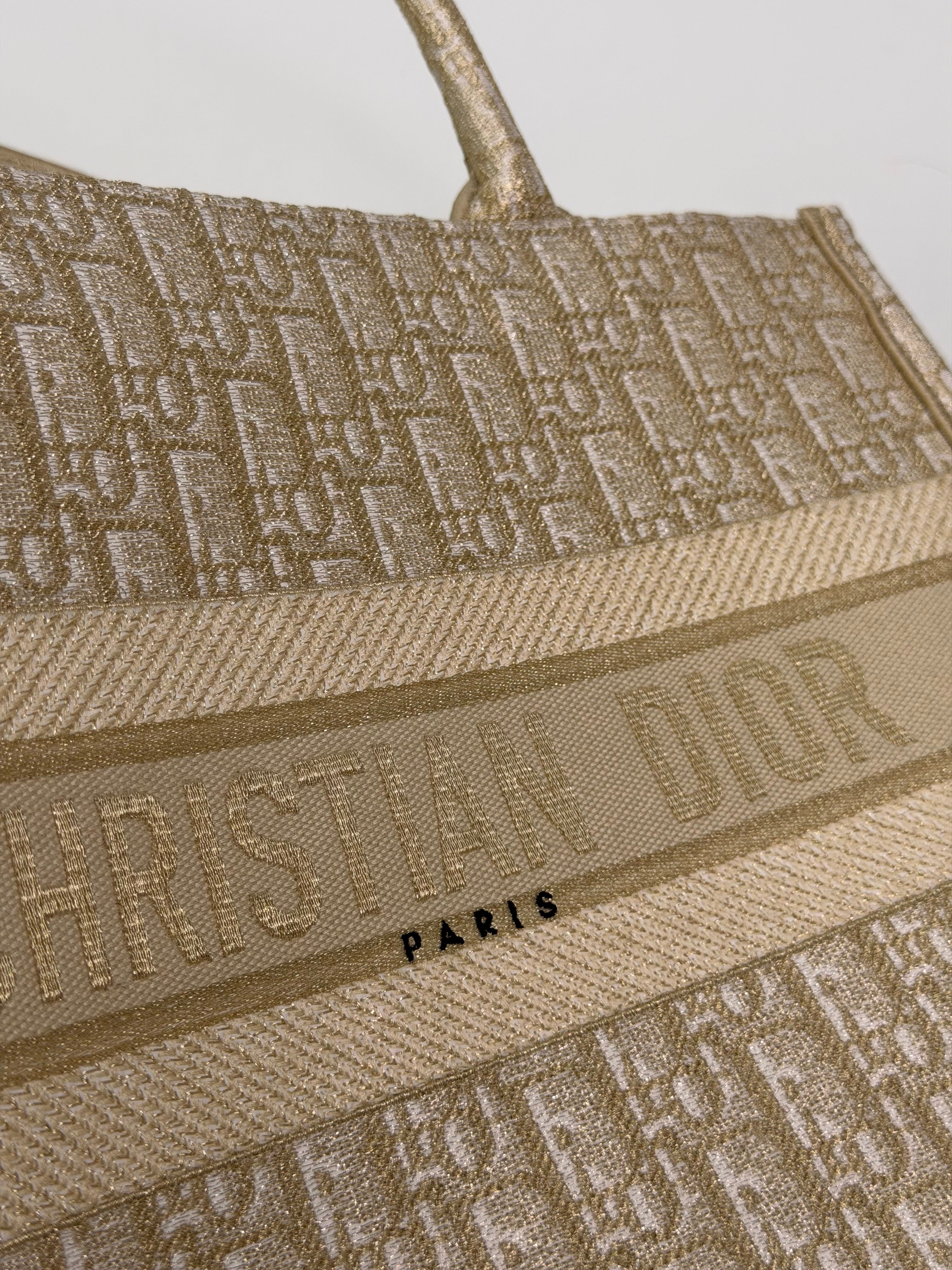 Christian Dior Medium Book Tote In Latte & Gold Tone Dioresque. Authentic and preloved in new and unused condition. 100% trusted guarantee