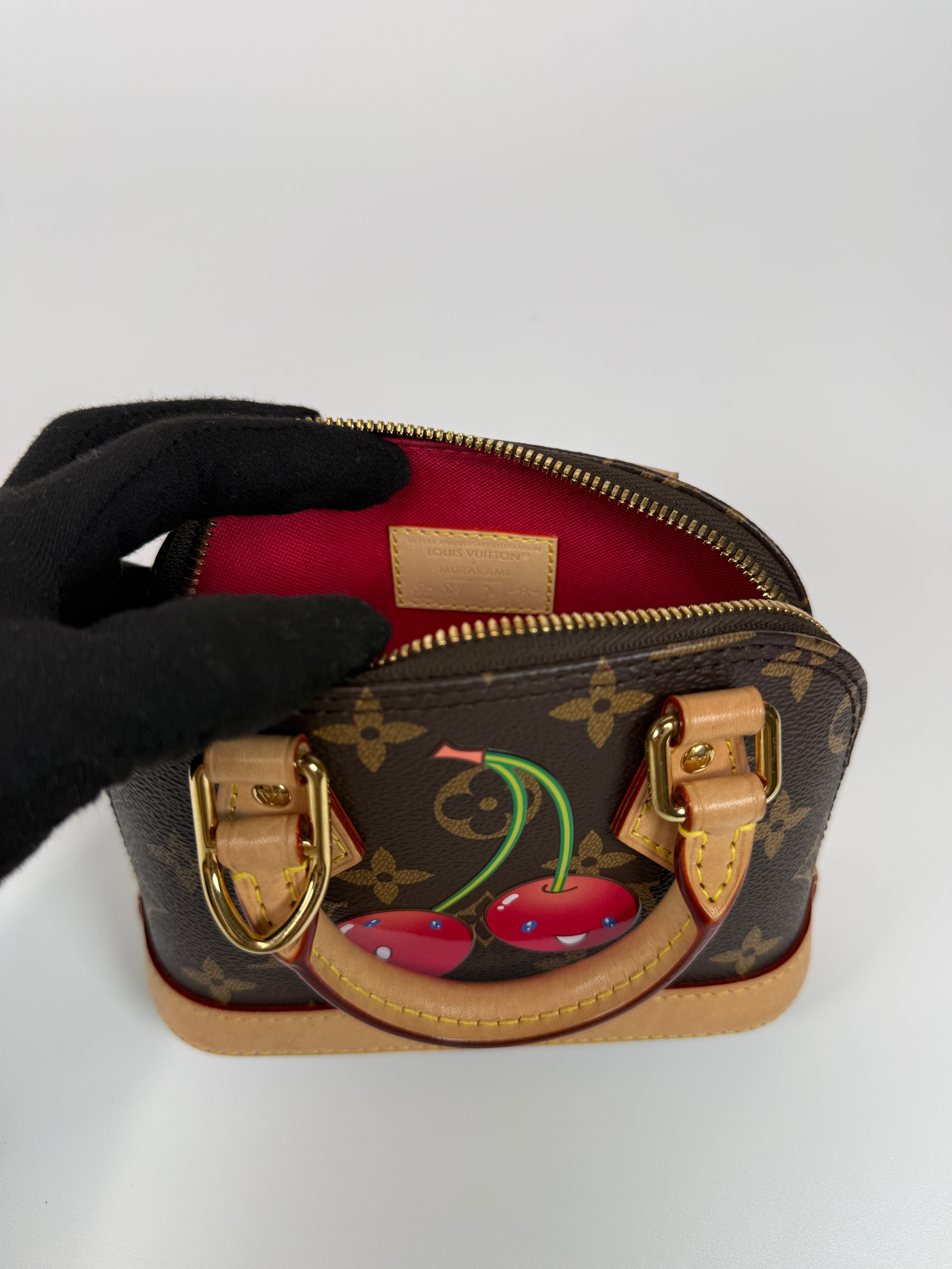 Authentic and preloved Louis Vuitton X Takashi Murakami Nano Alma Cherry Brown Monogram. Excellent condition. 100% Authenticity guarantee. Verified by Luxe Cheshire. 