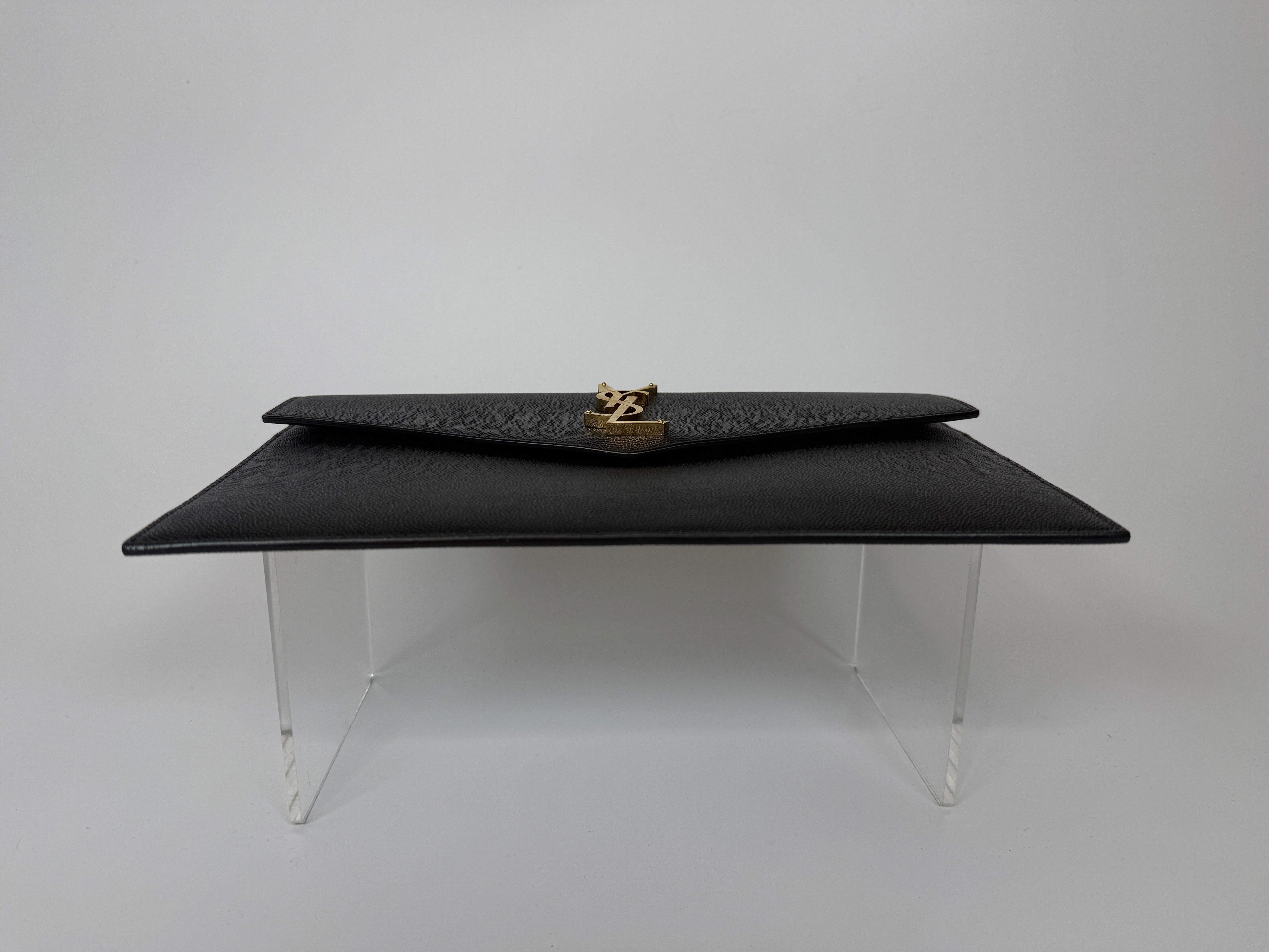 Saint Laurent Uptown Clutch In Black Leather With Gold Hardware. Authentic and preloved, 100% authenticity guarantee 