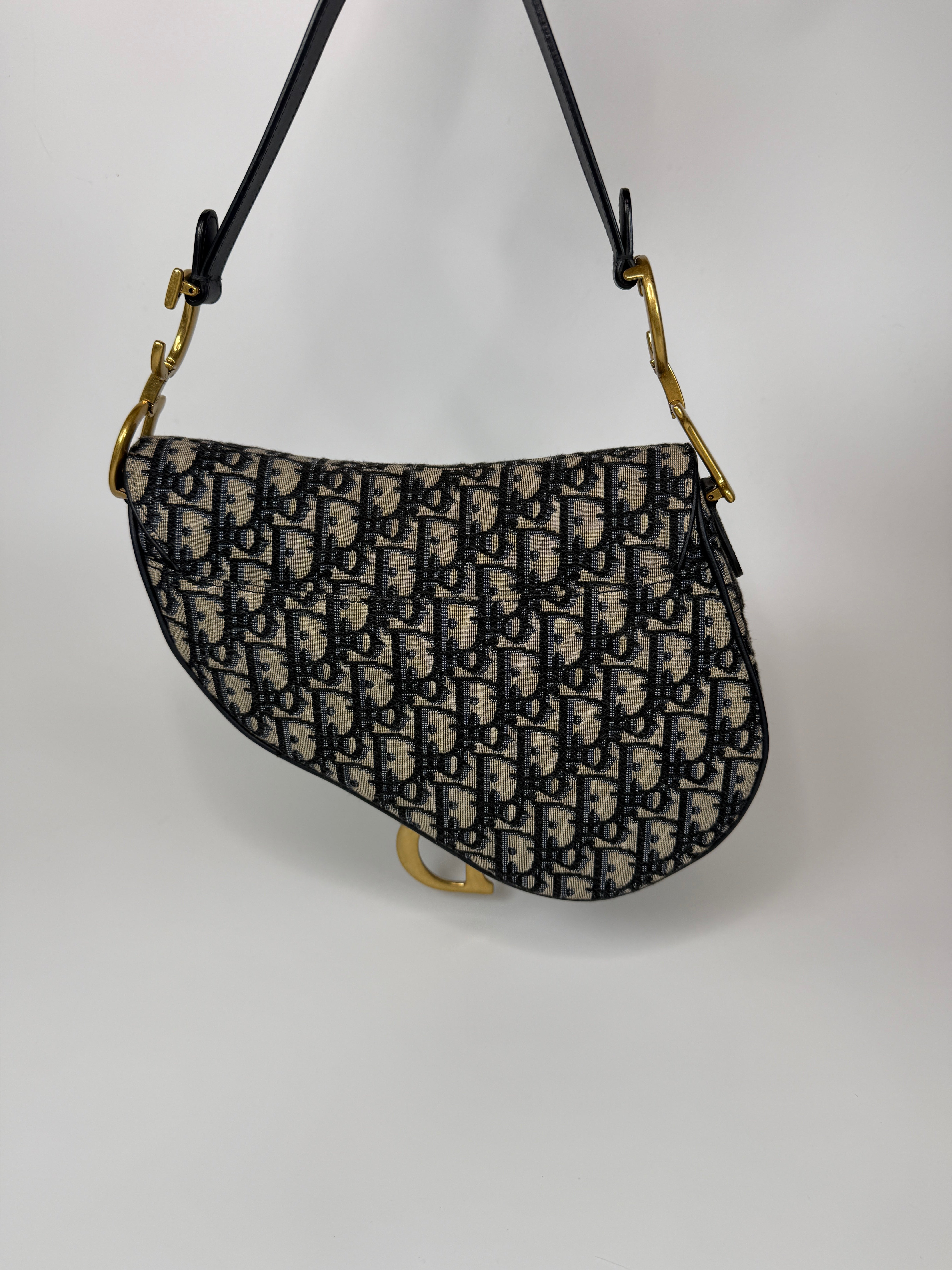 Authentic and preloved Christian Dior Saddle Bag In Oblique Canvas With Gold Hardware. Excellent condition. 100% Authenticity Guarantee 